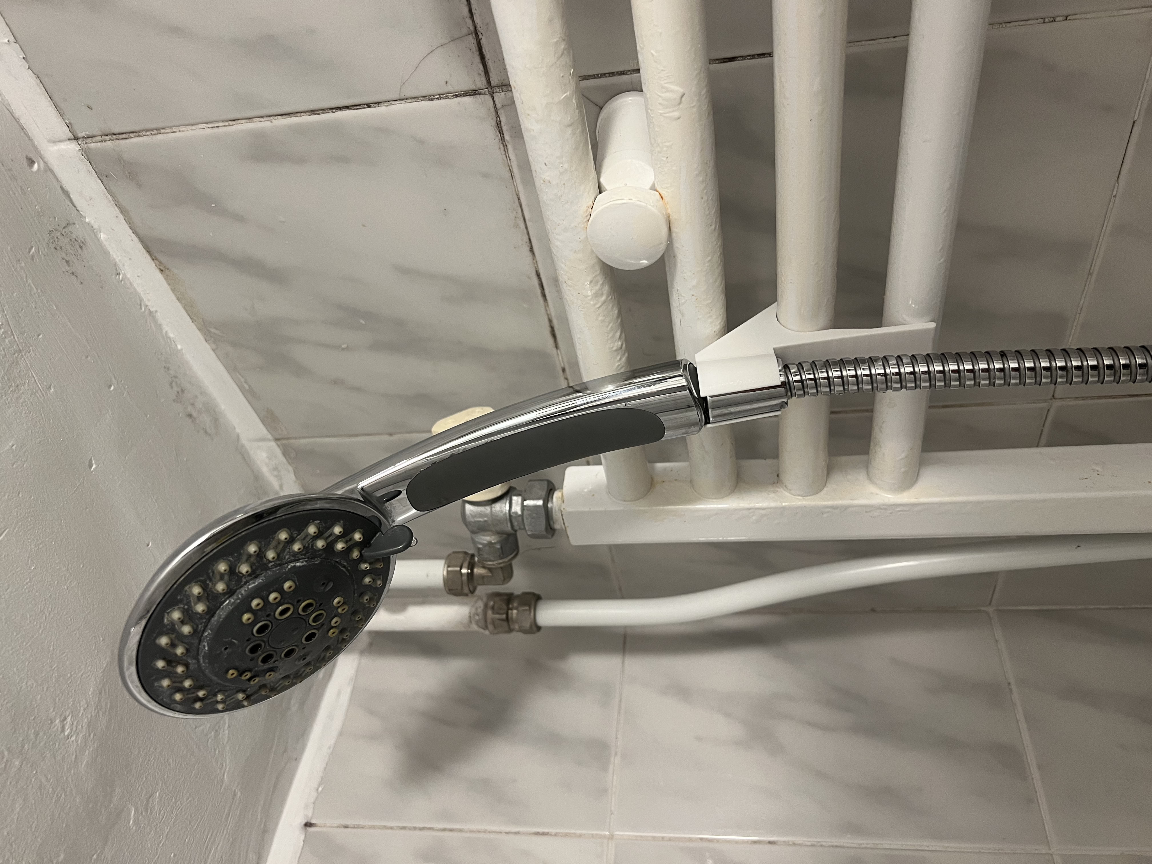 Shower head holder for bathroom heater