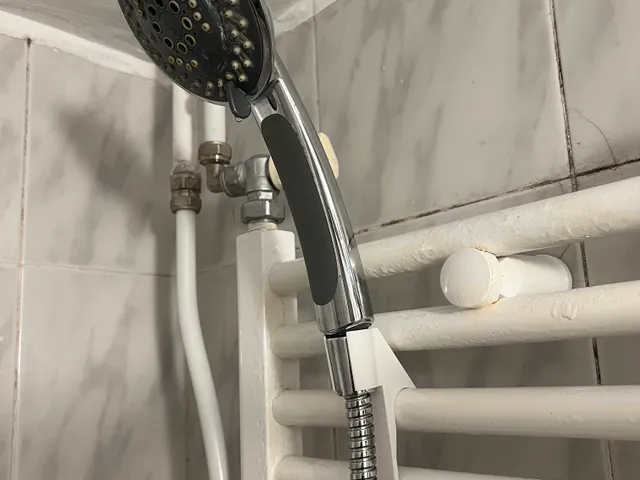 Shower head holder for bathroom heater
