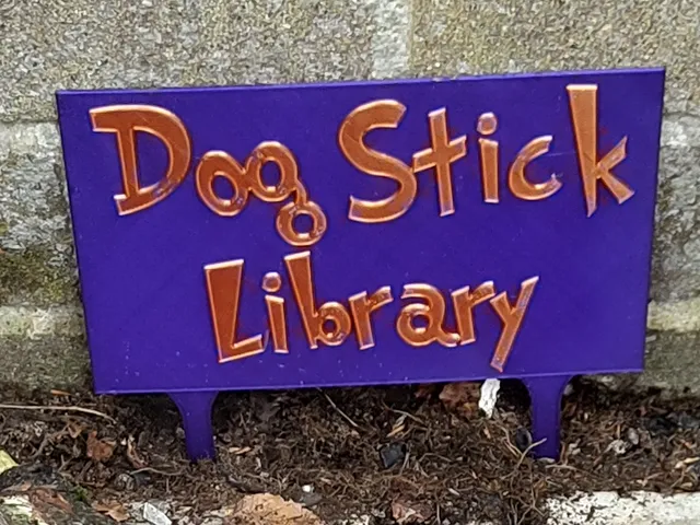 Dog Stick Library Sign