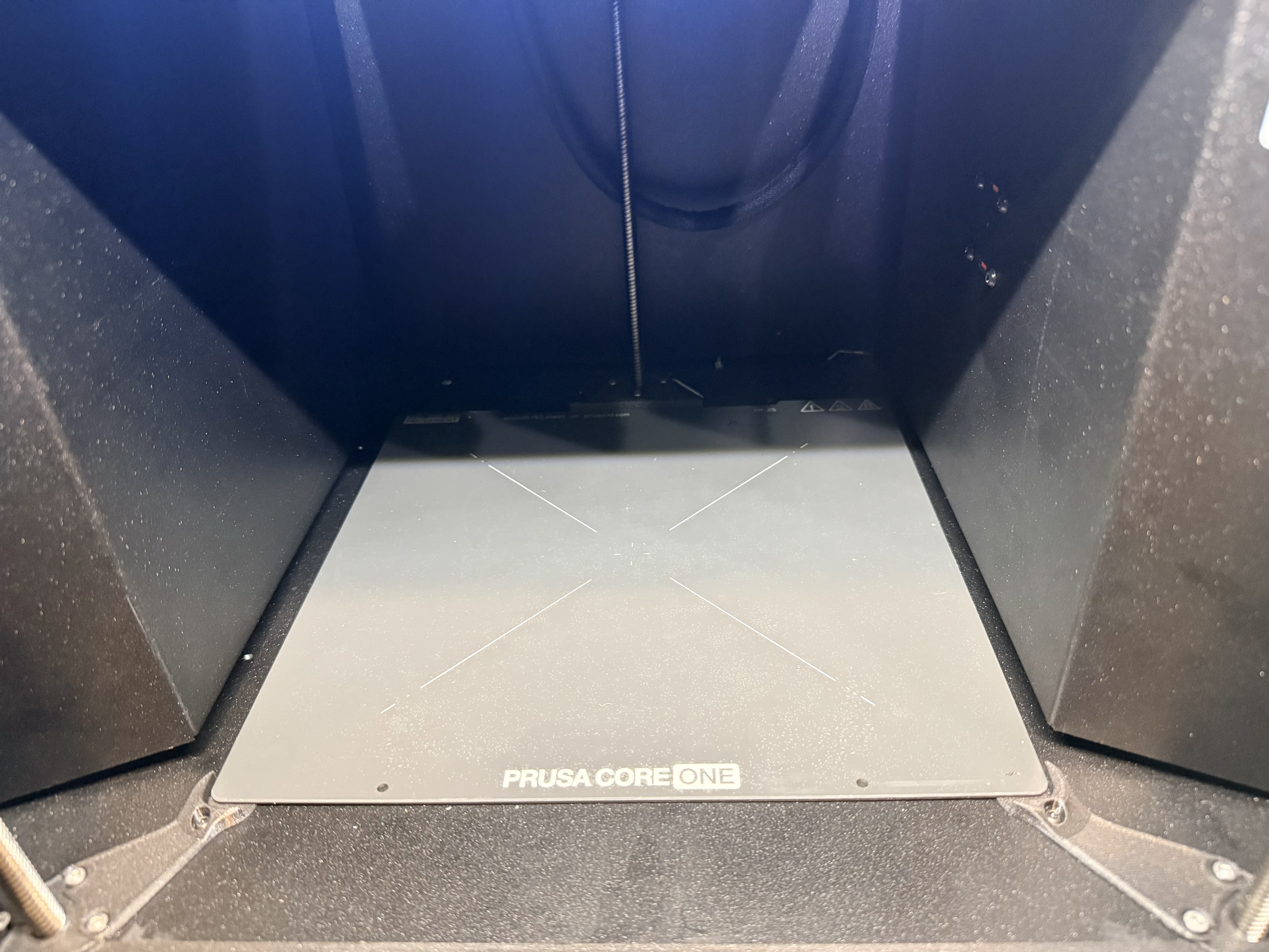 Core One bottom plate storage with dust cover