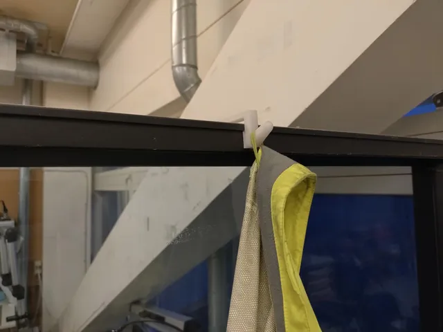Coat hanger for EFG divider wall
