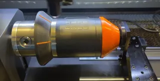 Conical Gripper and tail-stock cup for chuck-style rotary.