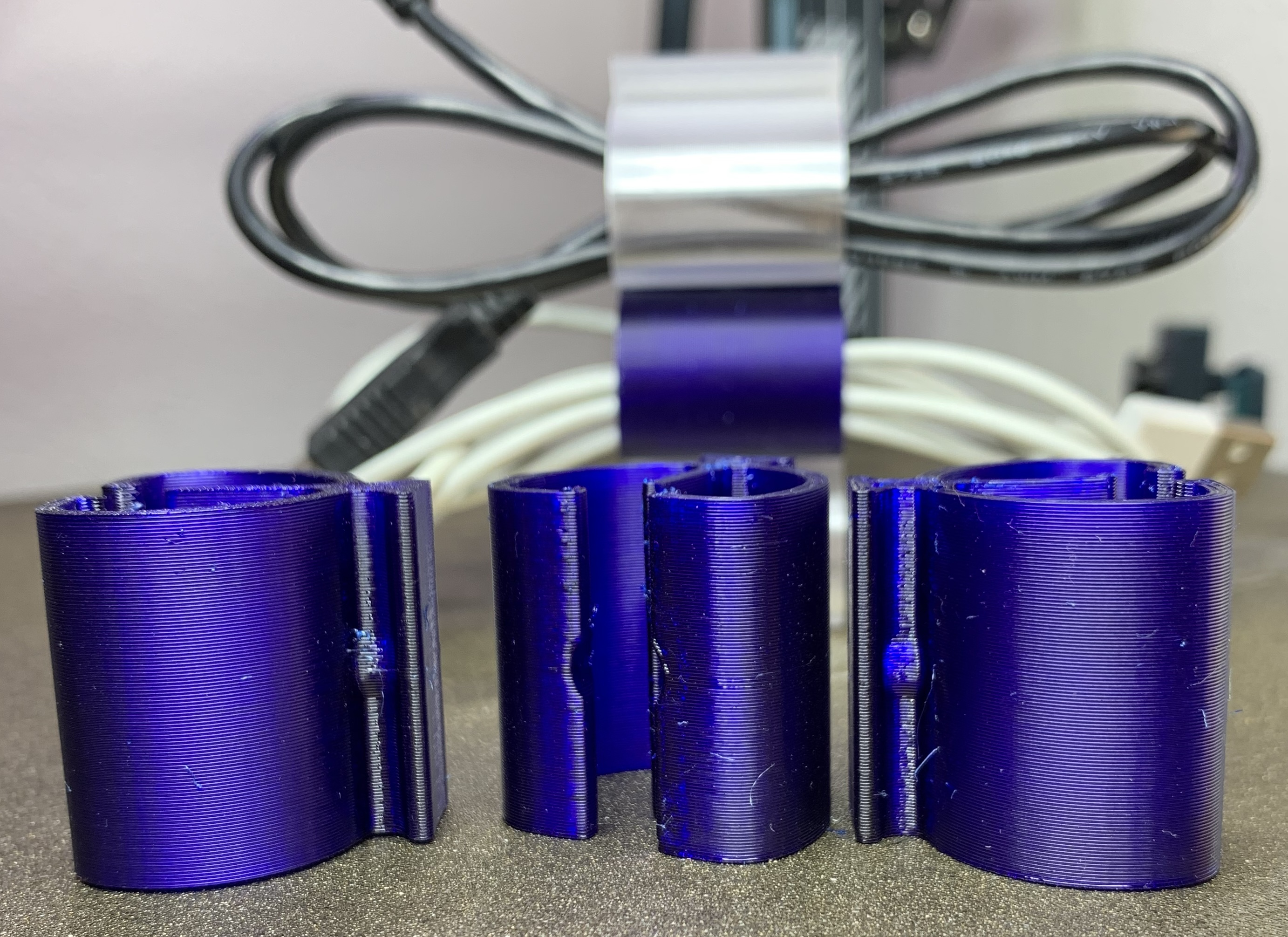 Connectable cable organizer with a slot and bump to hold multiple of them together