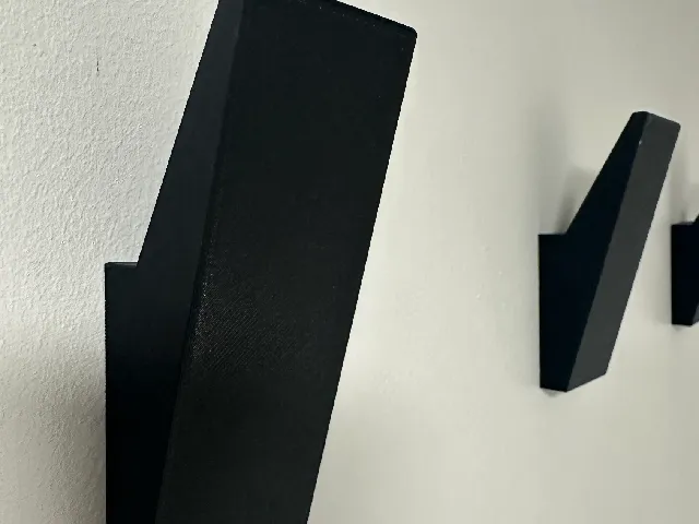 Modern towel wall mount pegs, no visible screws