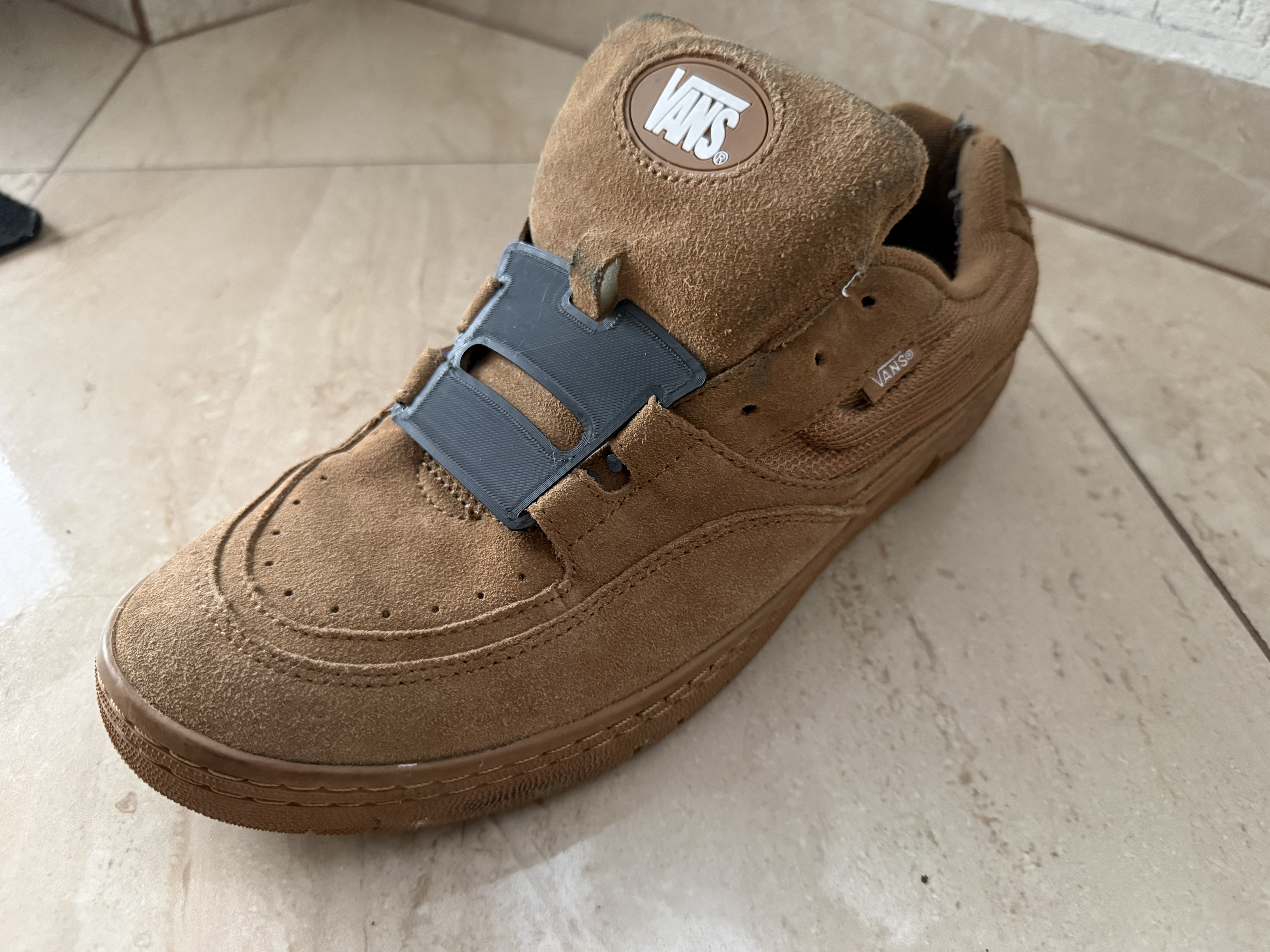 Vans shoe lace plate.