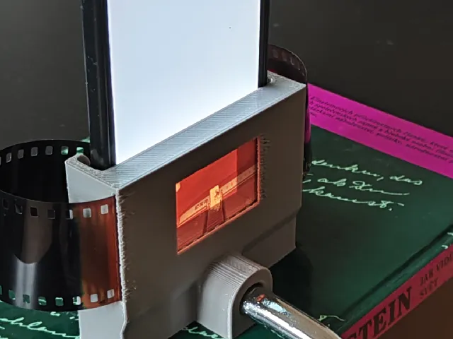 Fixture for camera film scan
