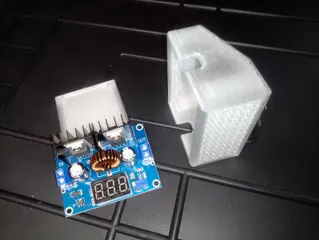 Voltage regulator cover with ventilation