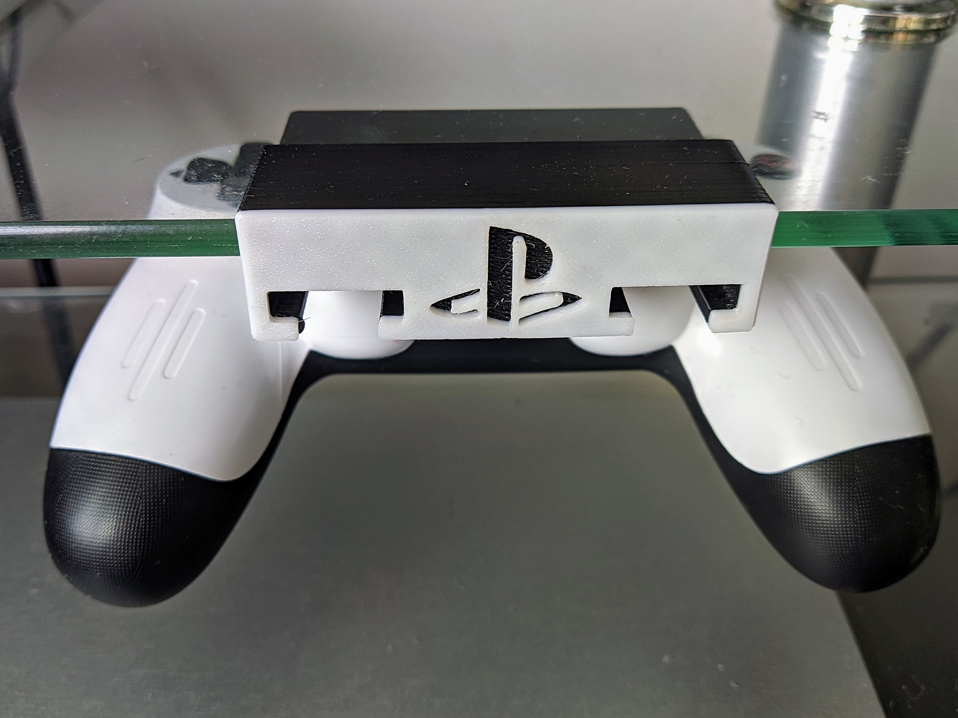 PS4 DualShock 4 and PS5 DualSense controller under desk mount