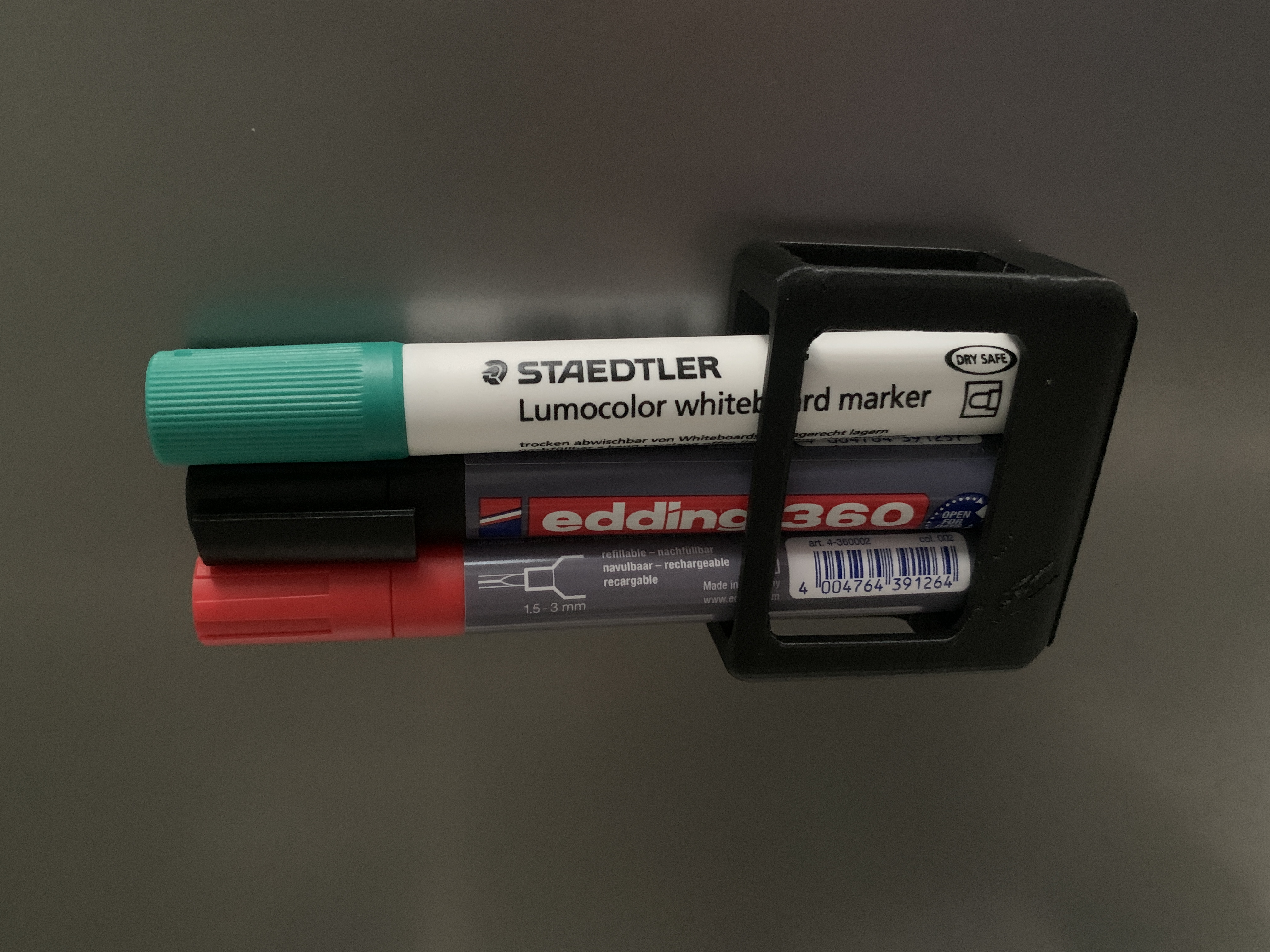 Magnetic whiteboard marker holder