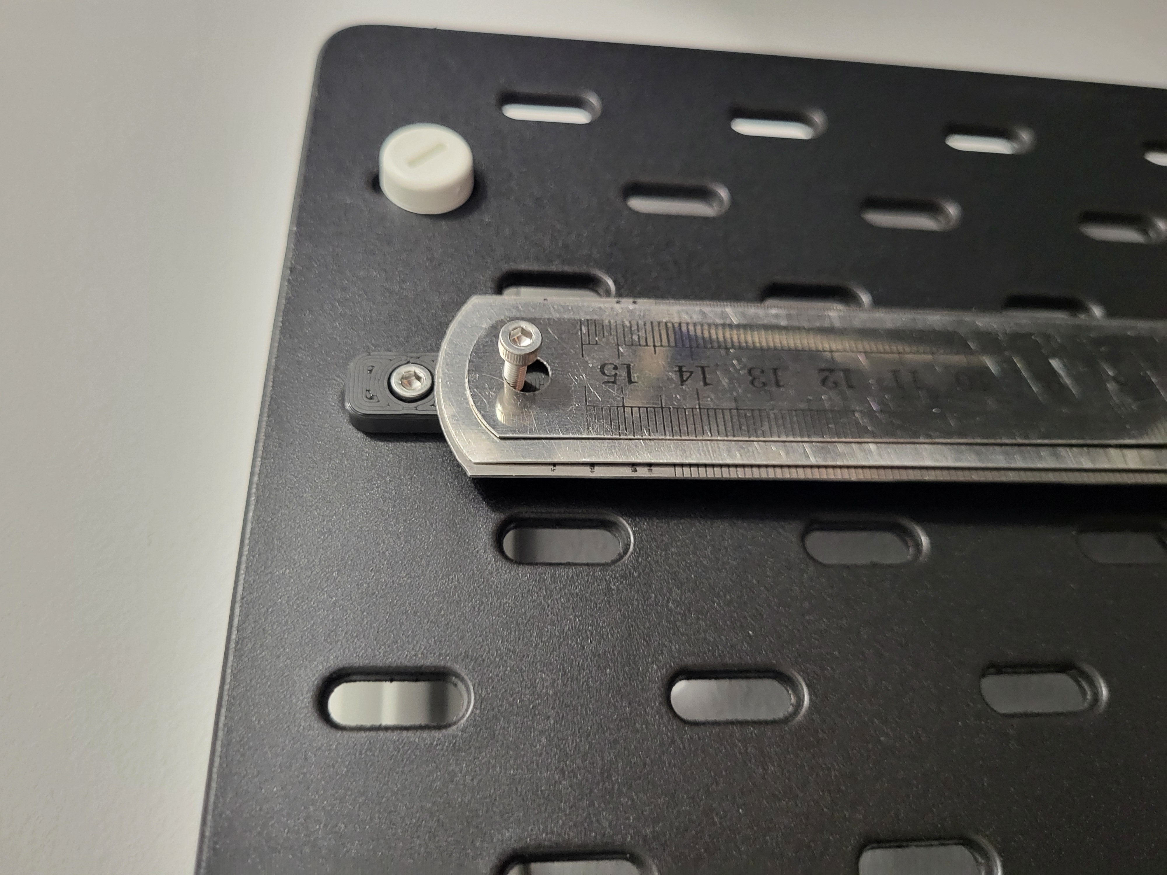 Skadis ruler holder with T-nut mounting system