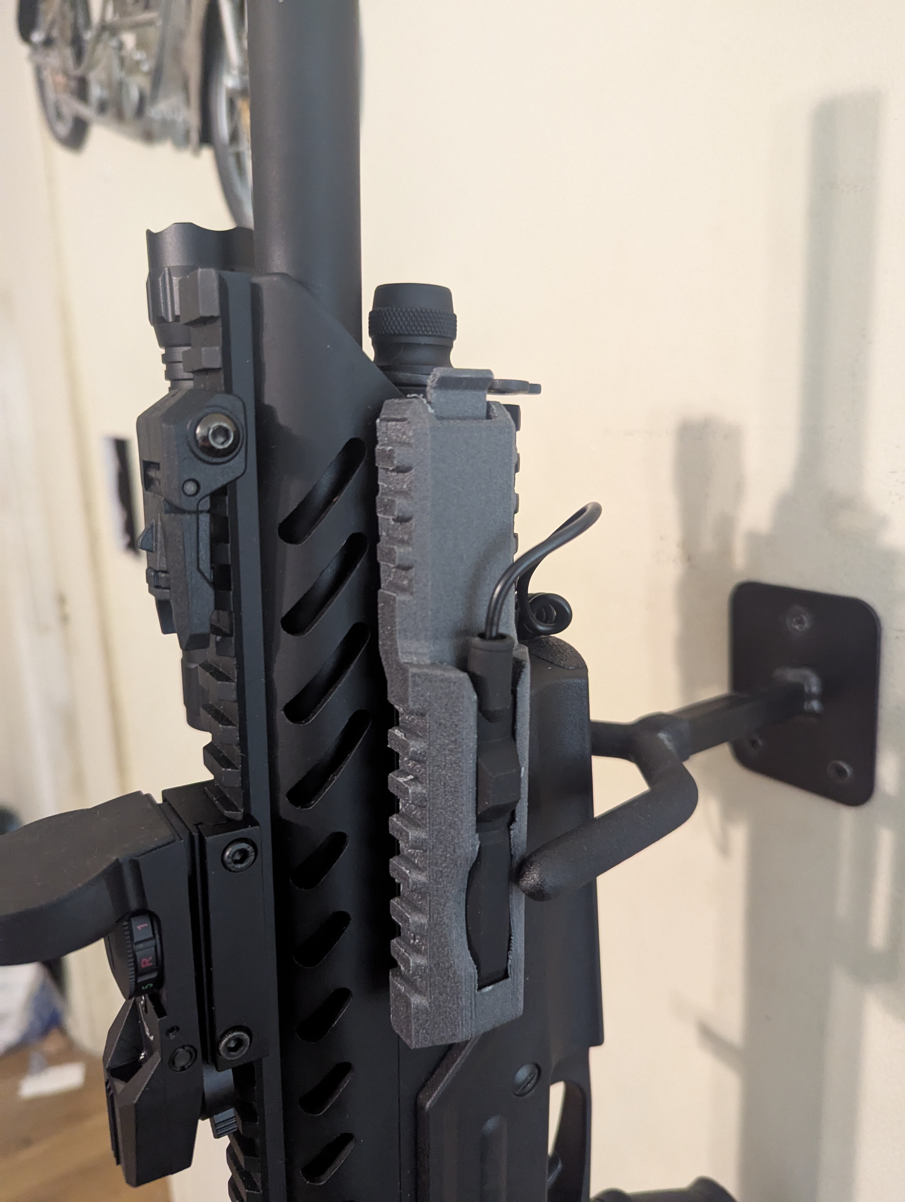 Tactical flashlight pressure switch picatinny rail mount with quick release tab.