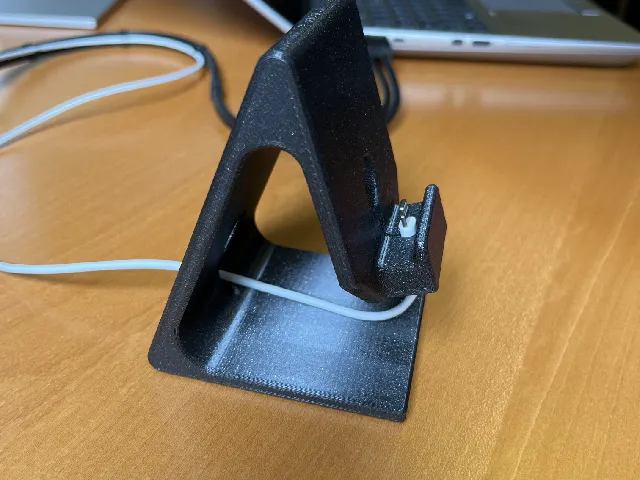 Phone Stand with Captive Charge Cable.