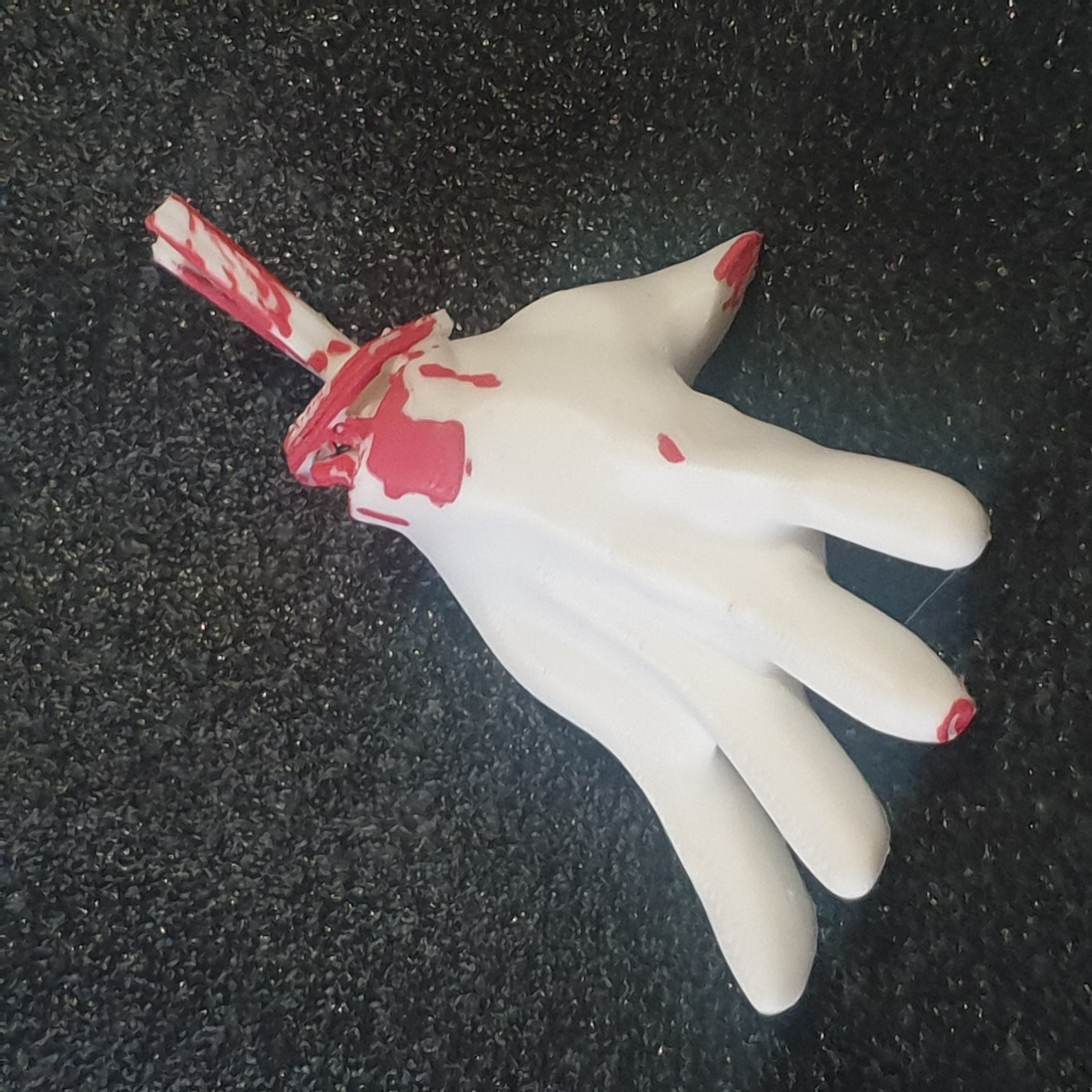 Micky's severed hand