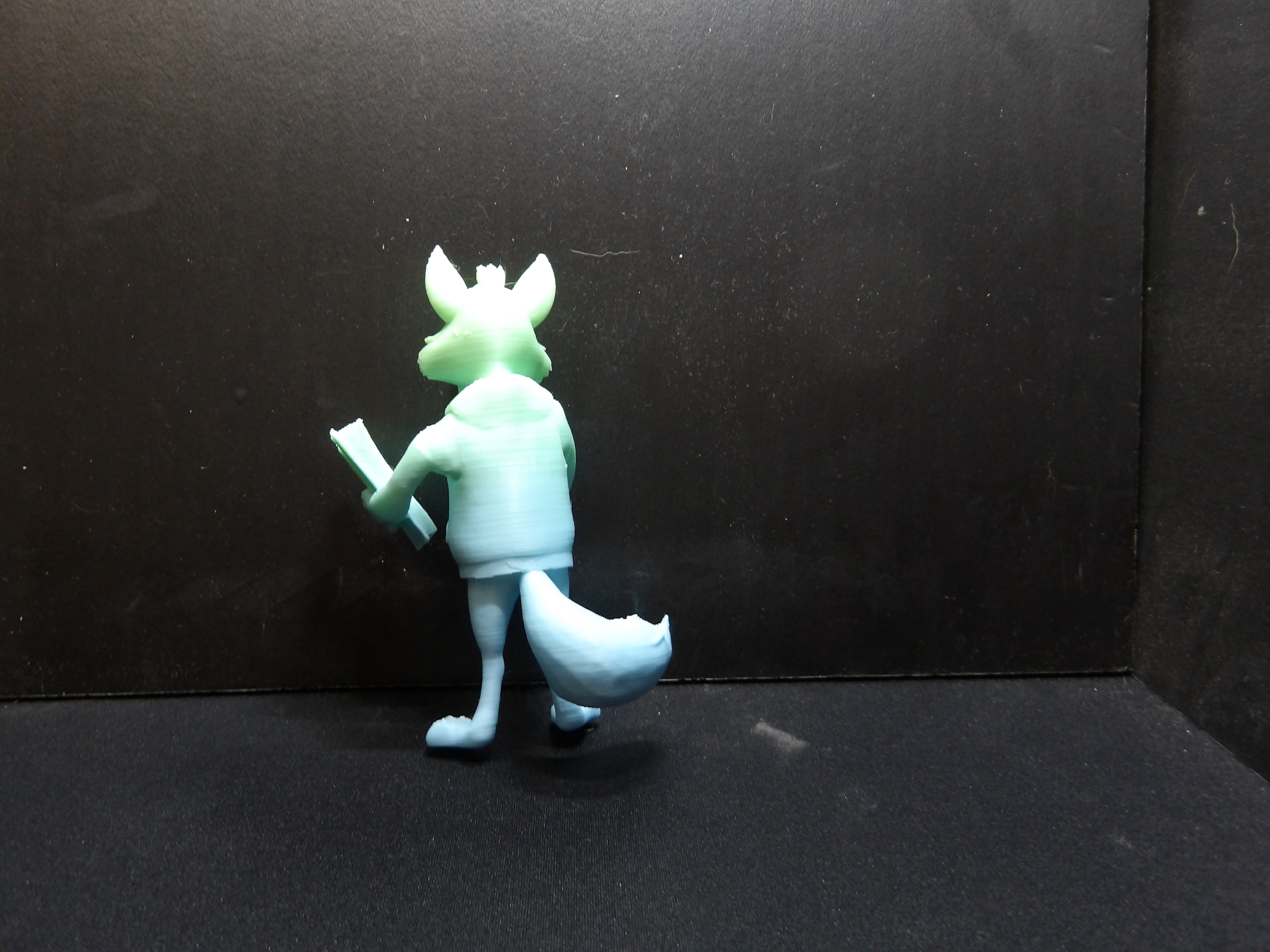 Standing wolf reading a book. — miniatura 2