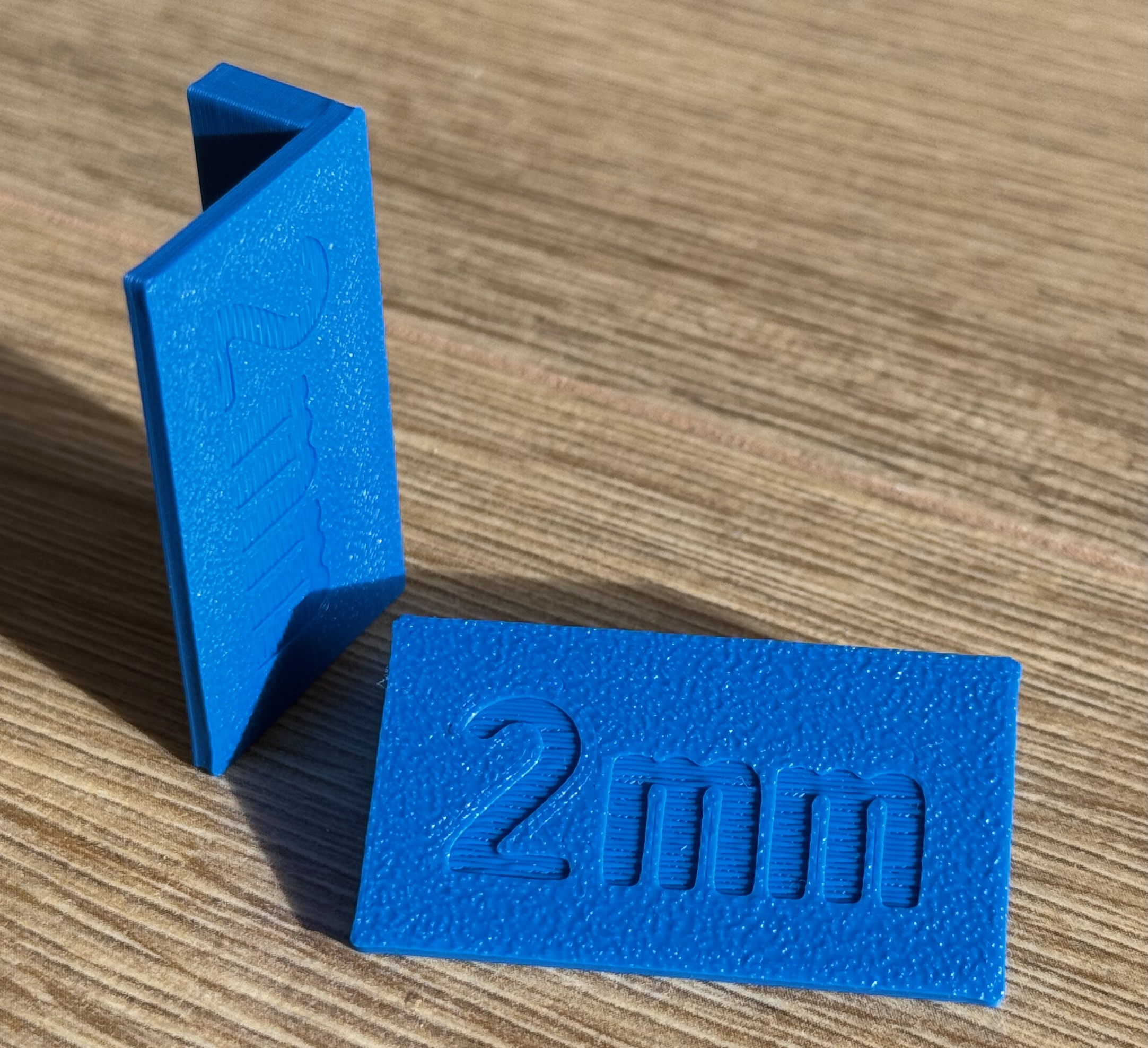 Front spacers for furniture drawer fronts and doors