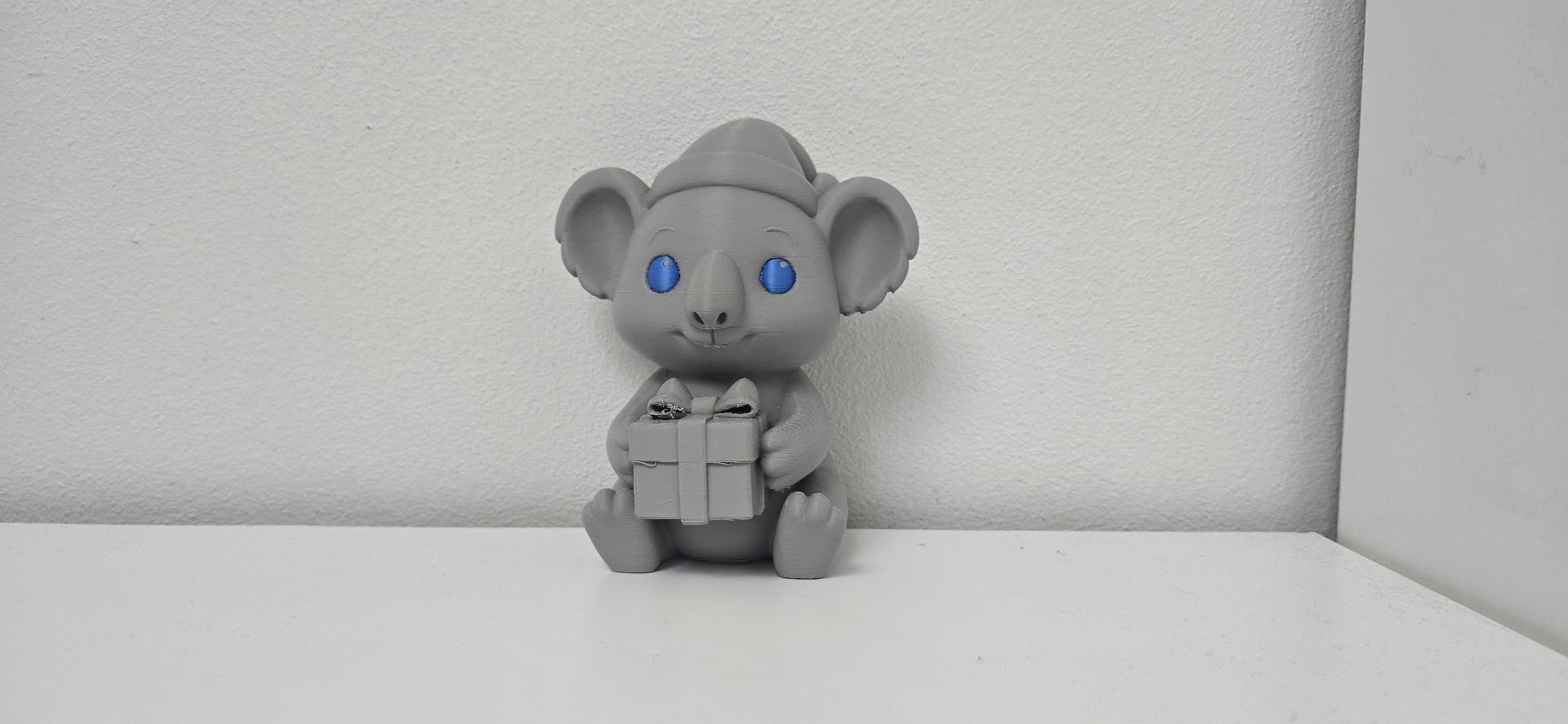 Koala with Gift and Santa Hat Christmas Figure