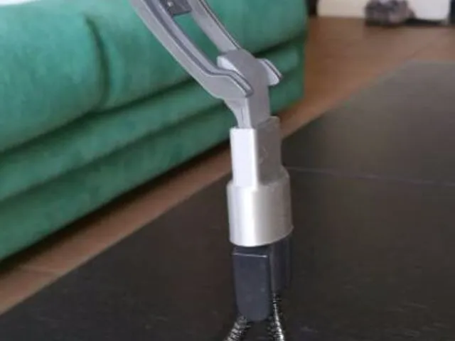Logitech webcam holder.