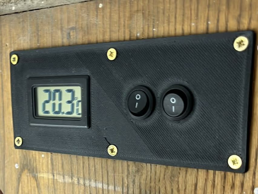 Control panel with thermometer.