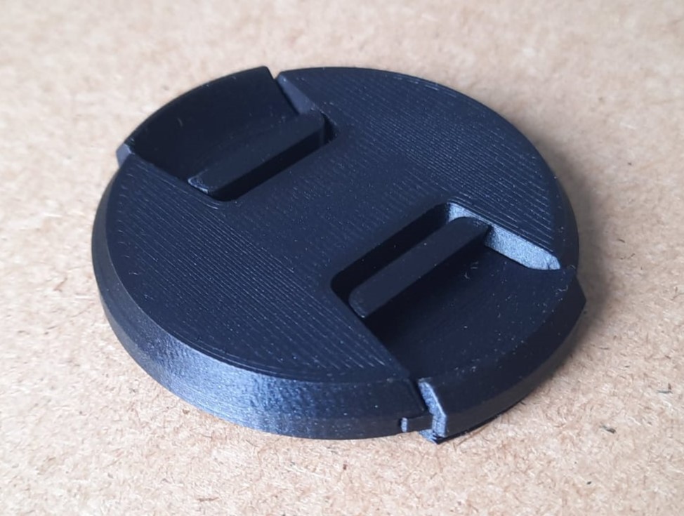 Camera lens lid with 3D printed springs