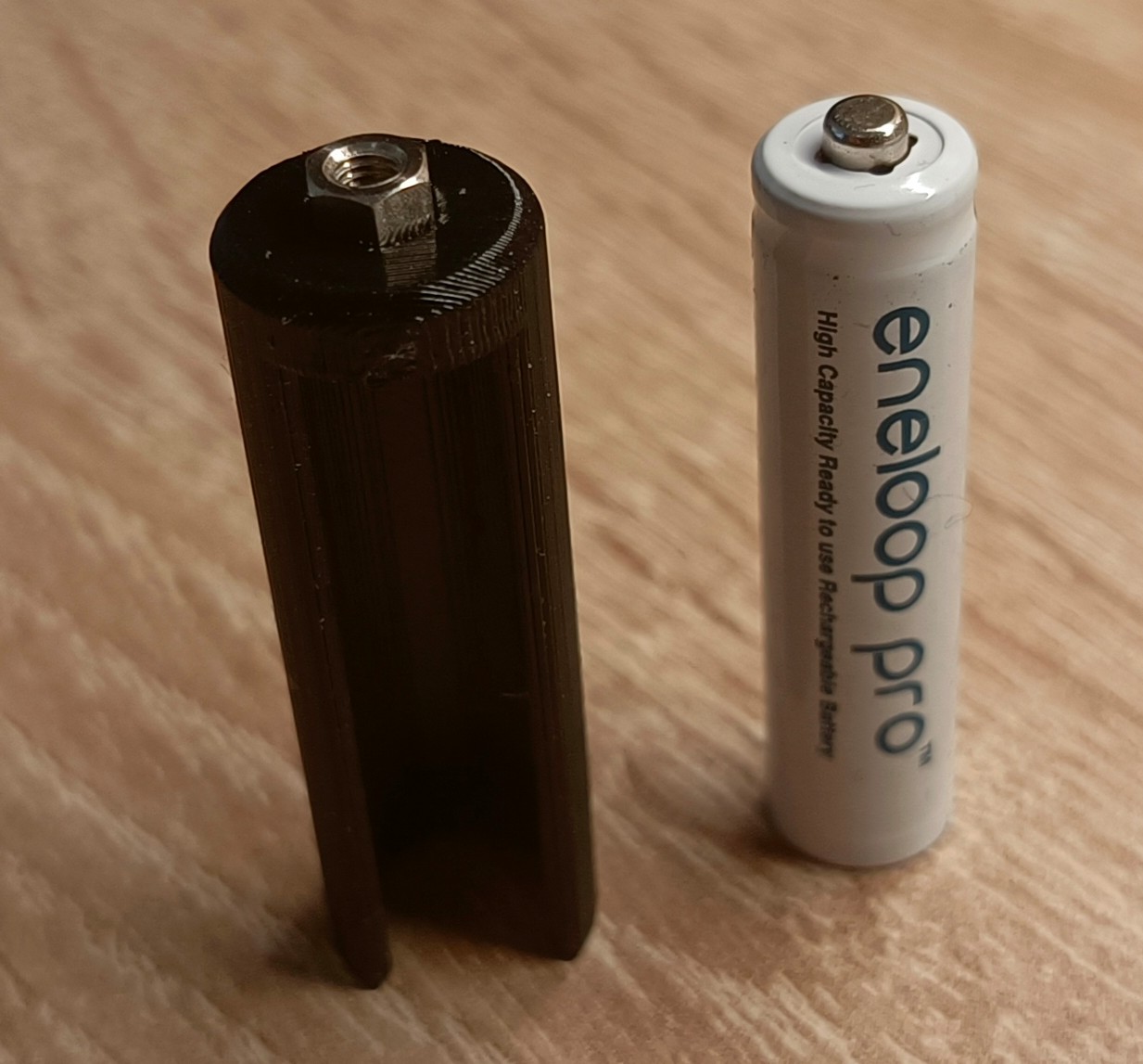 AAA battery adapter to AA charger by unit Download free STL model