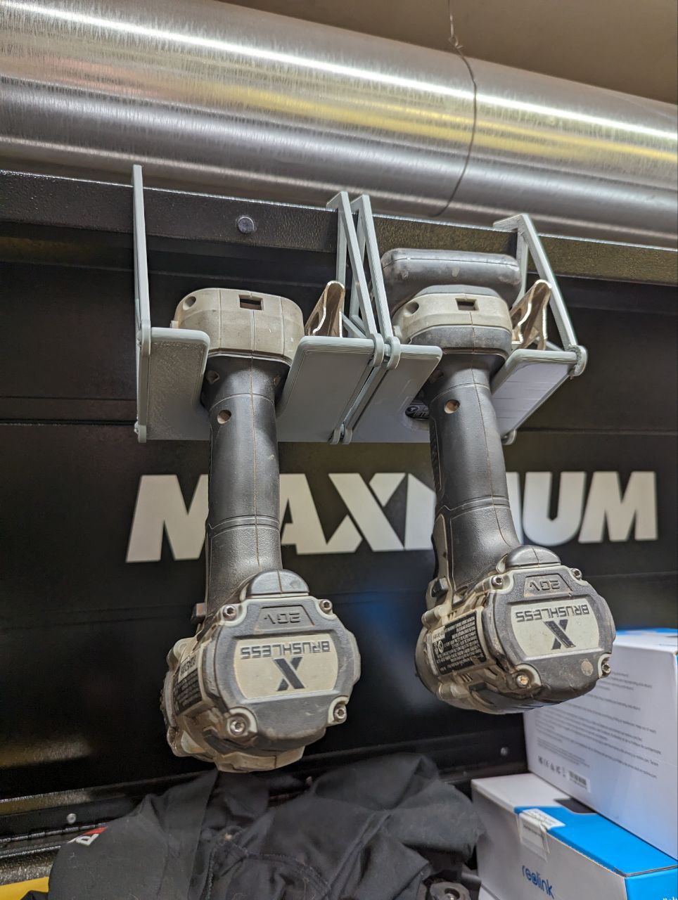 Power tool hanger from tool chest lid