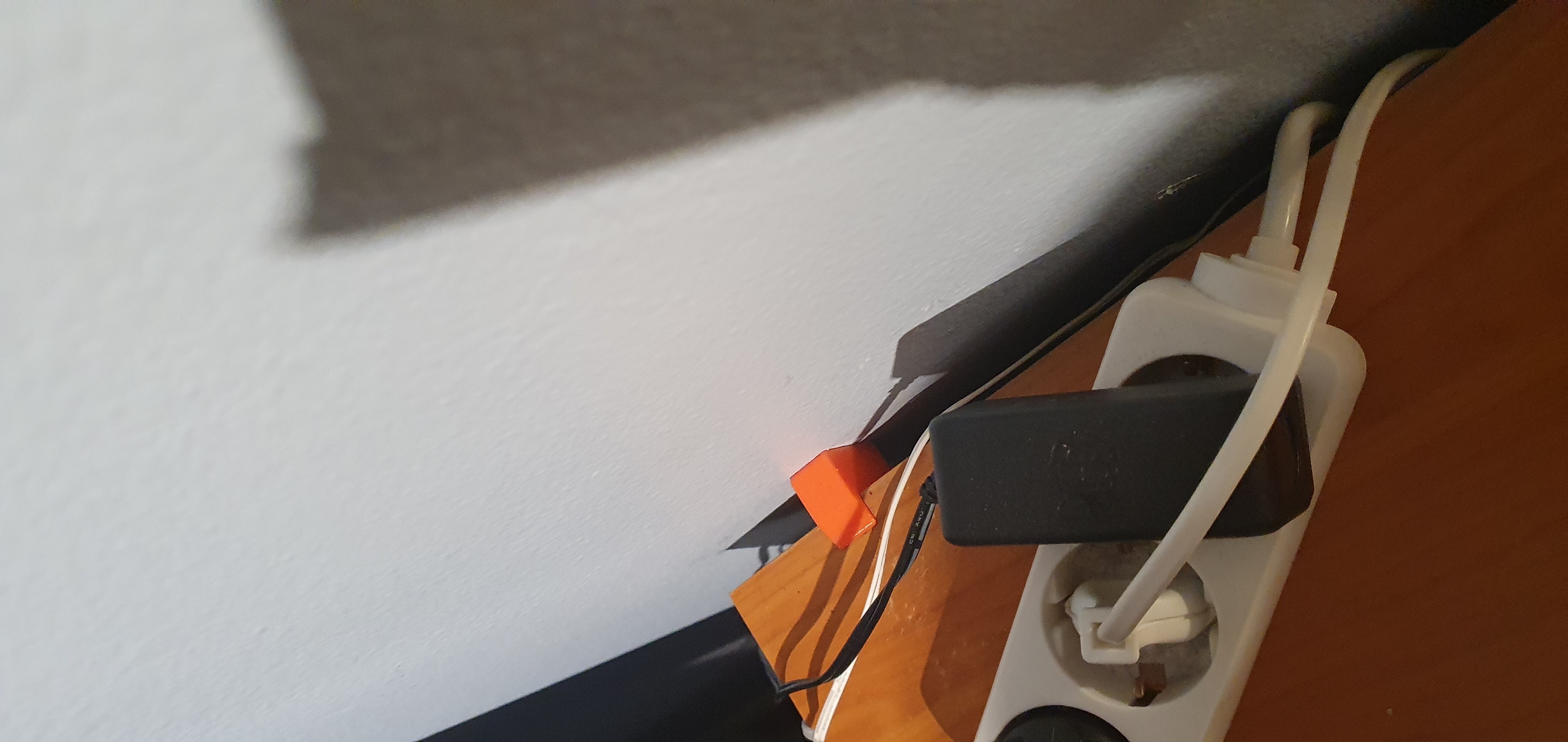 Bumper to be mounted between desk and wall