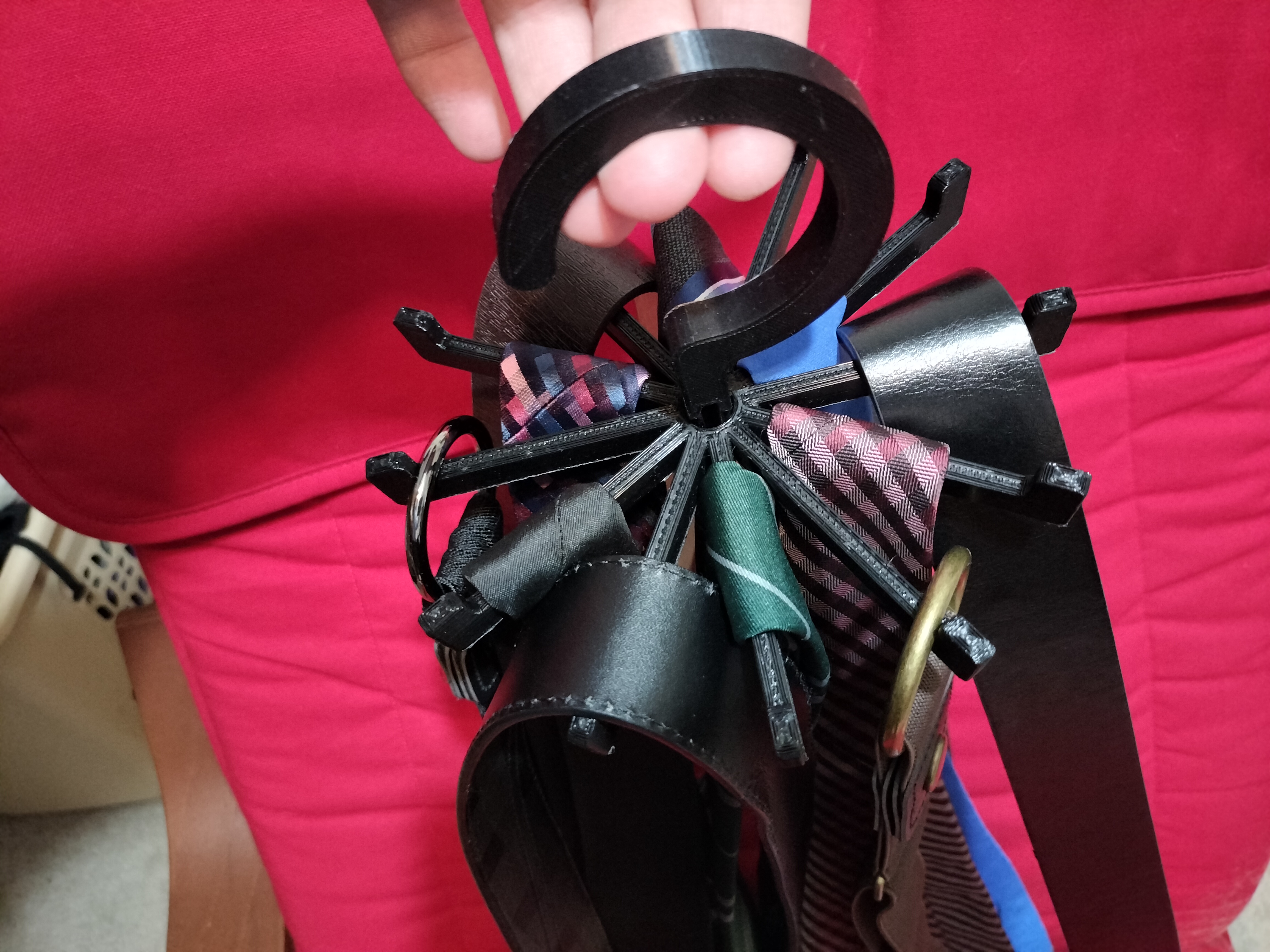 Stronger hook for rotating tie and belt hanger/holder
