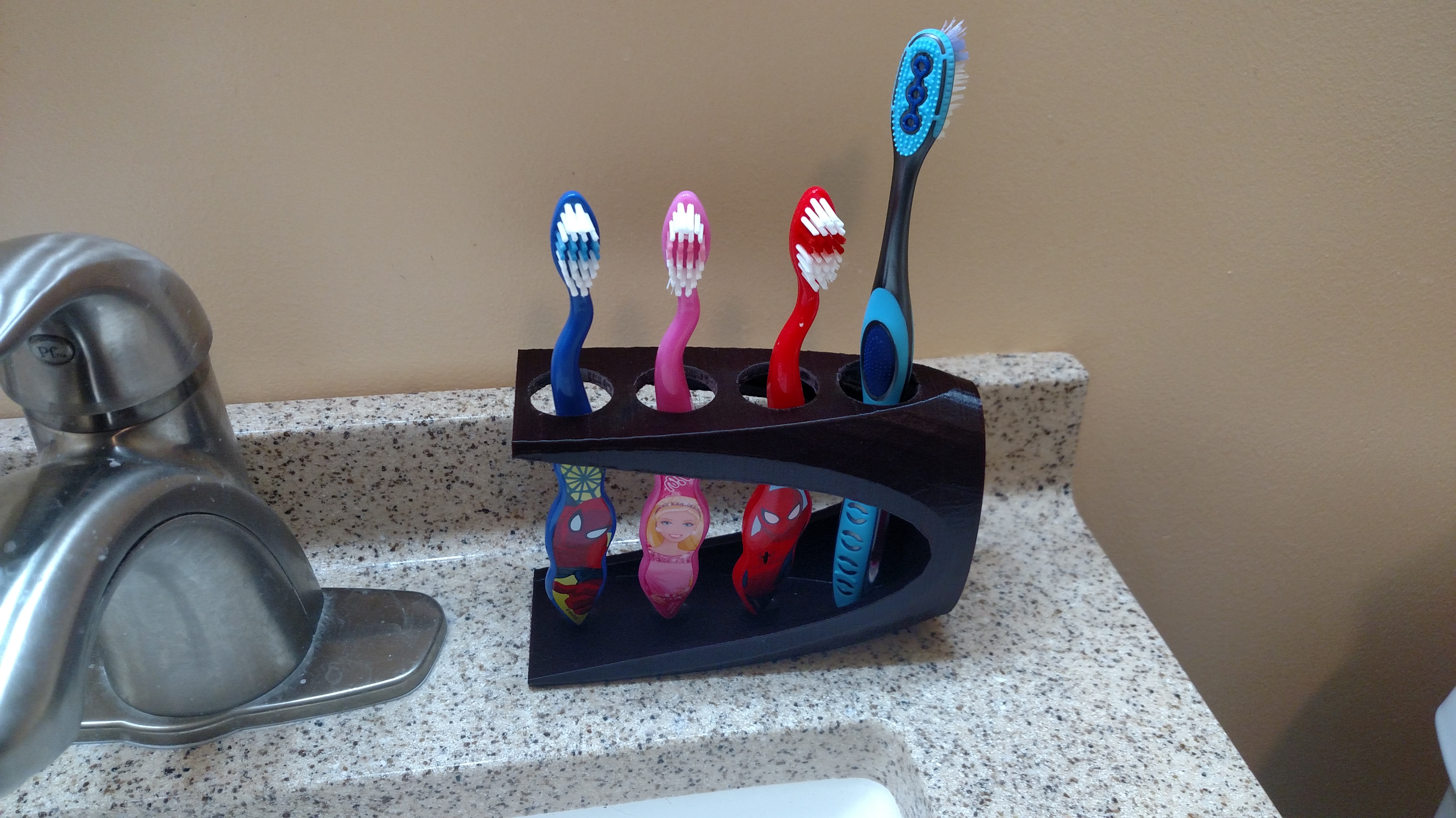 Tooth brush/paste holder