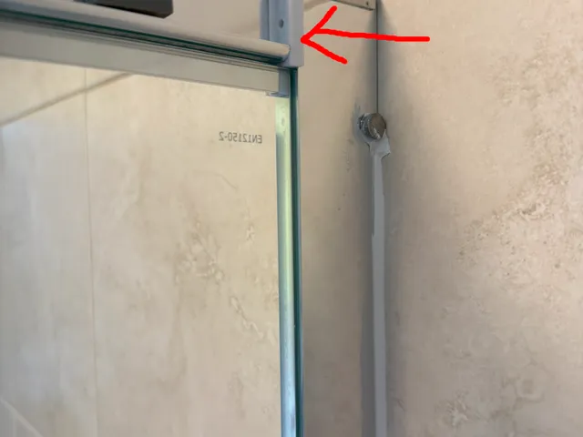 Shower enclosure bracket