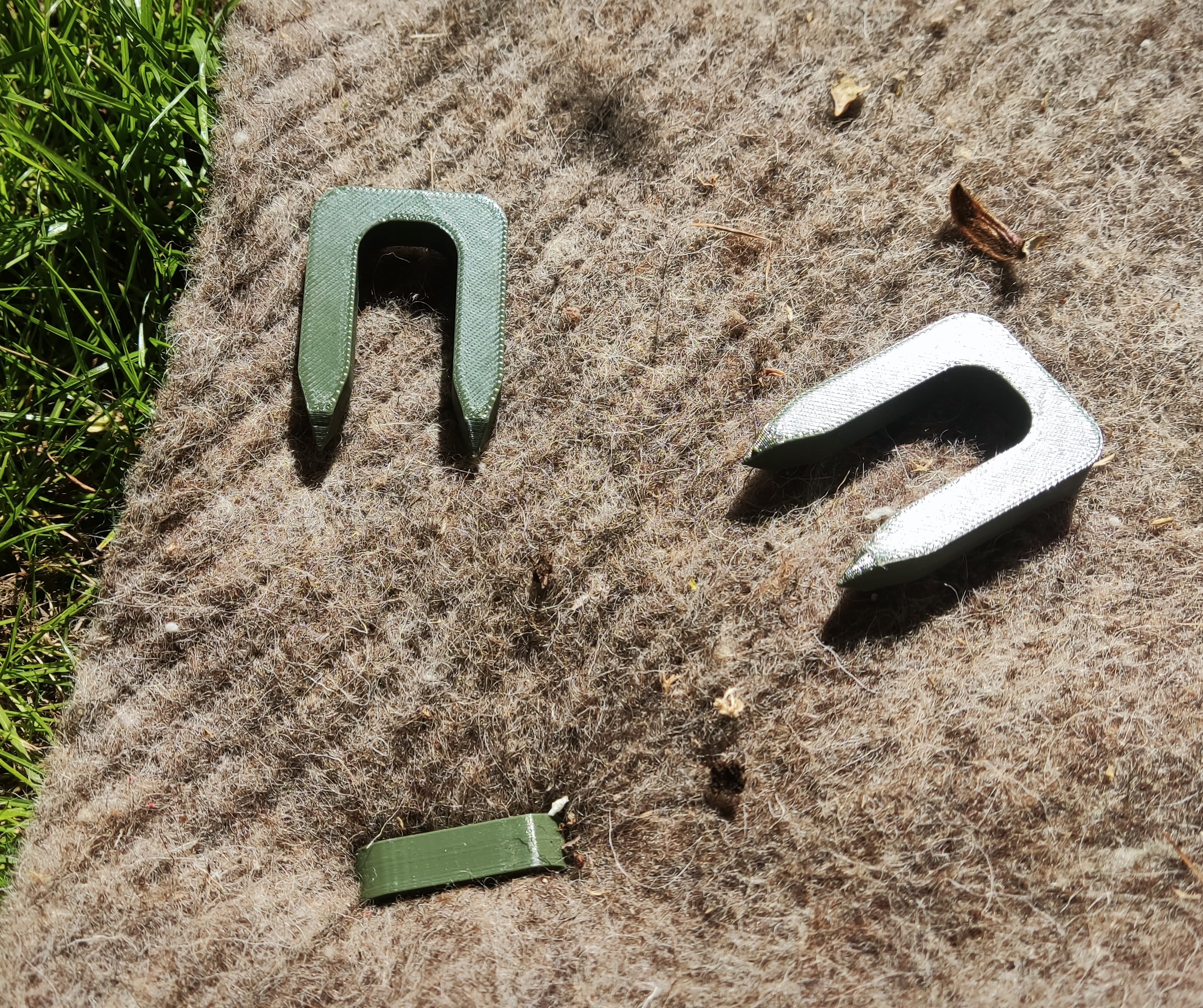 Pins for holding agrotextile, ground anchors for garden needs