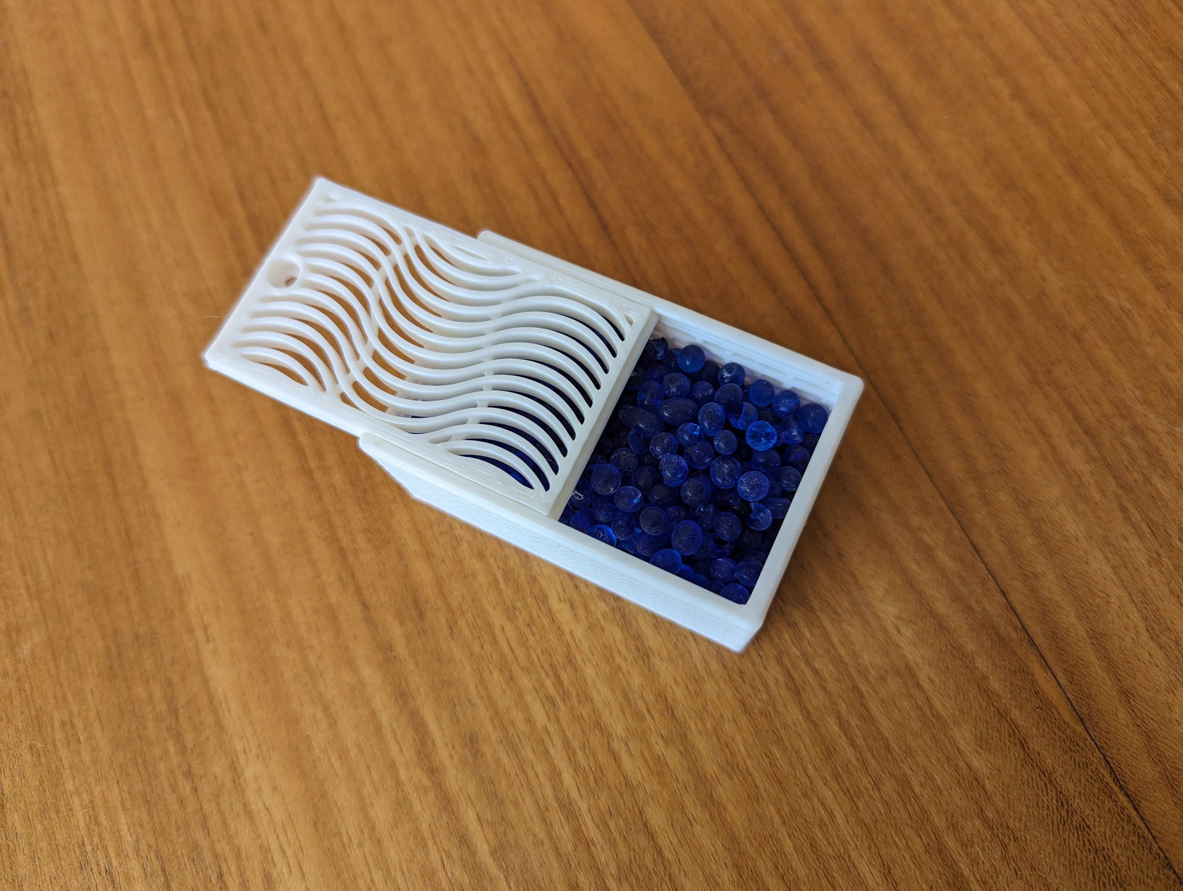 Modified dessicant box for cereal container filament dry box