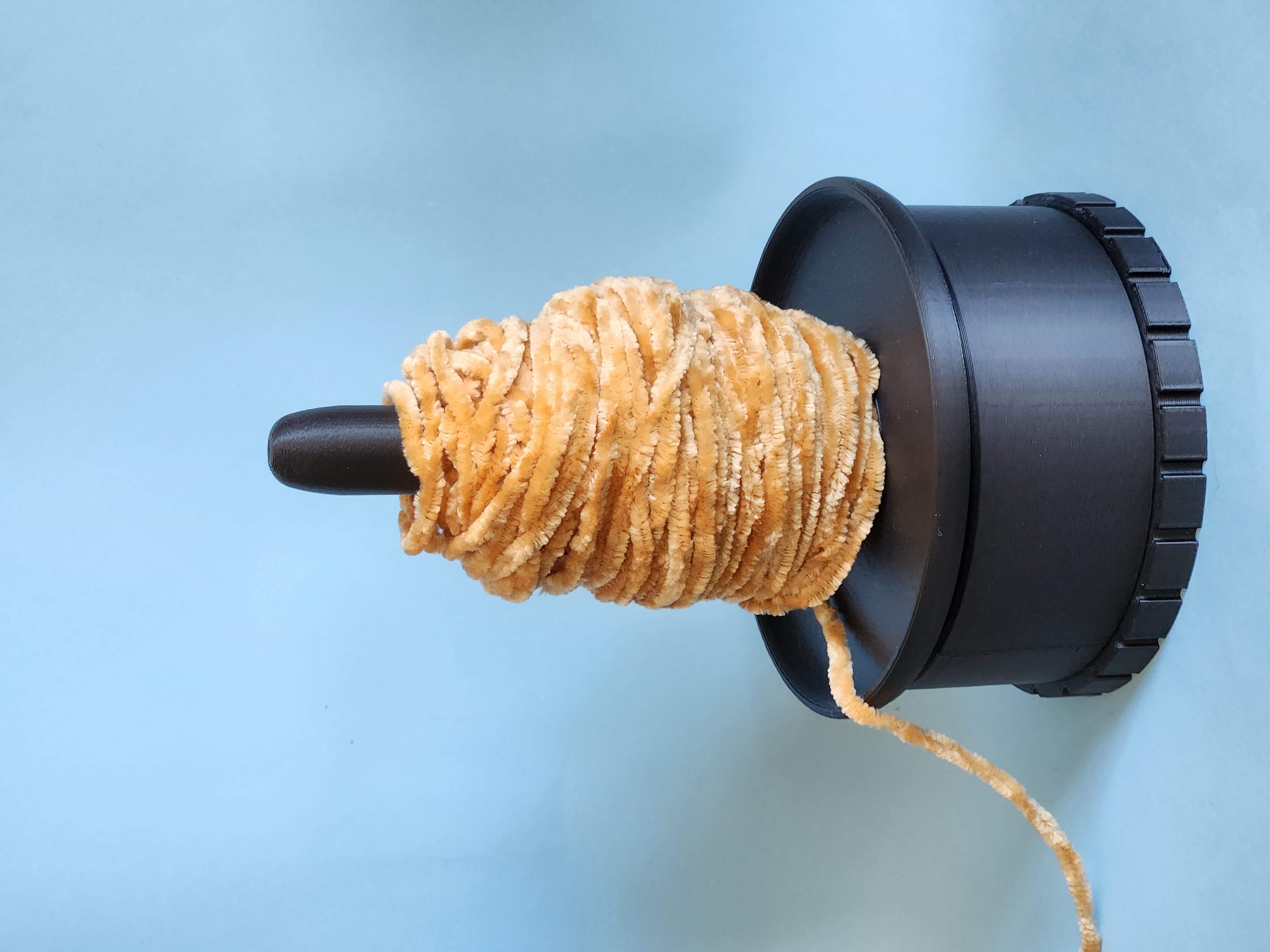 Yarn spinner/holder with weight
