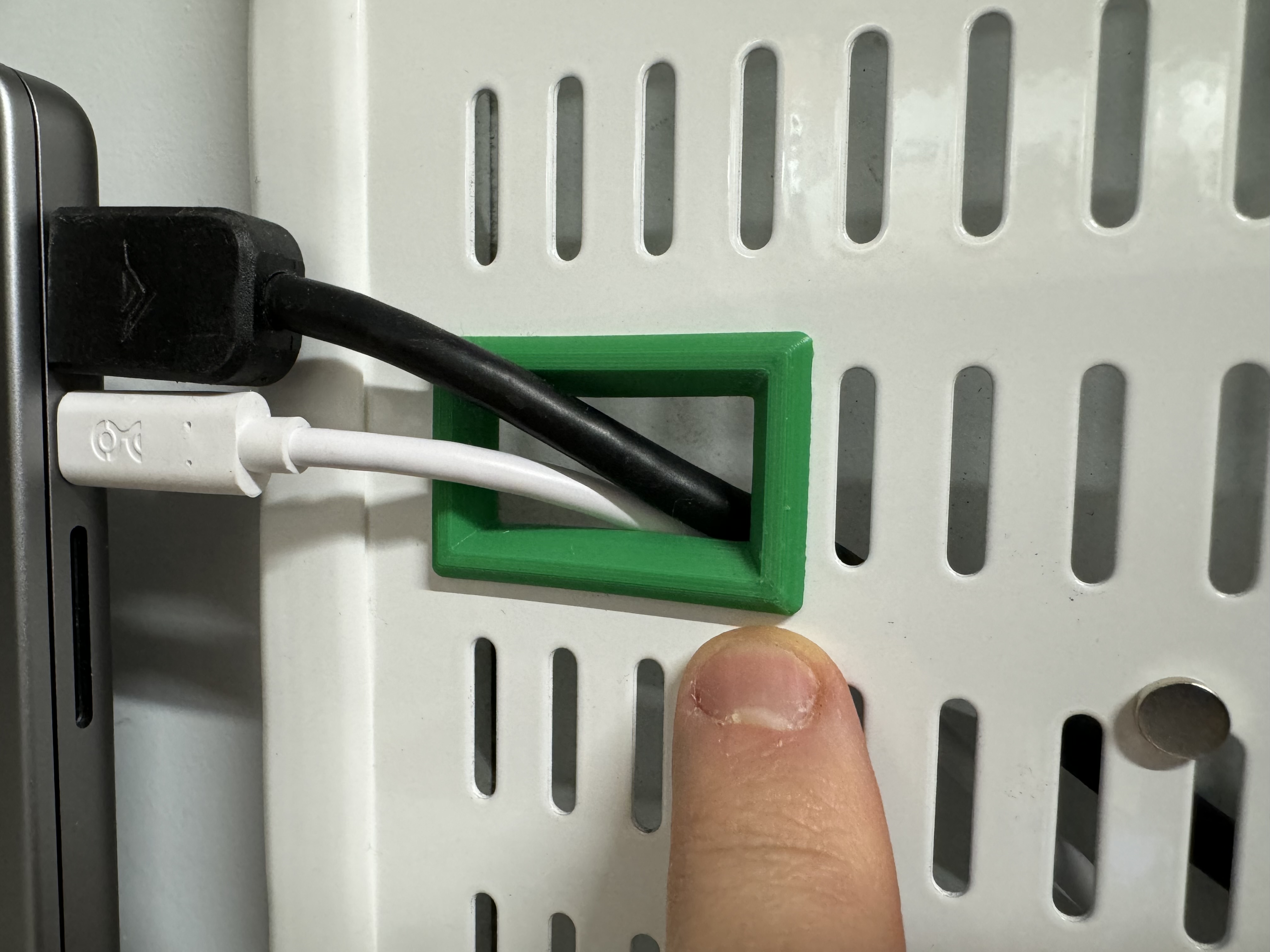 Elfa pegboard through-hole wireway bezel