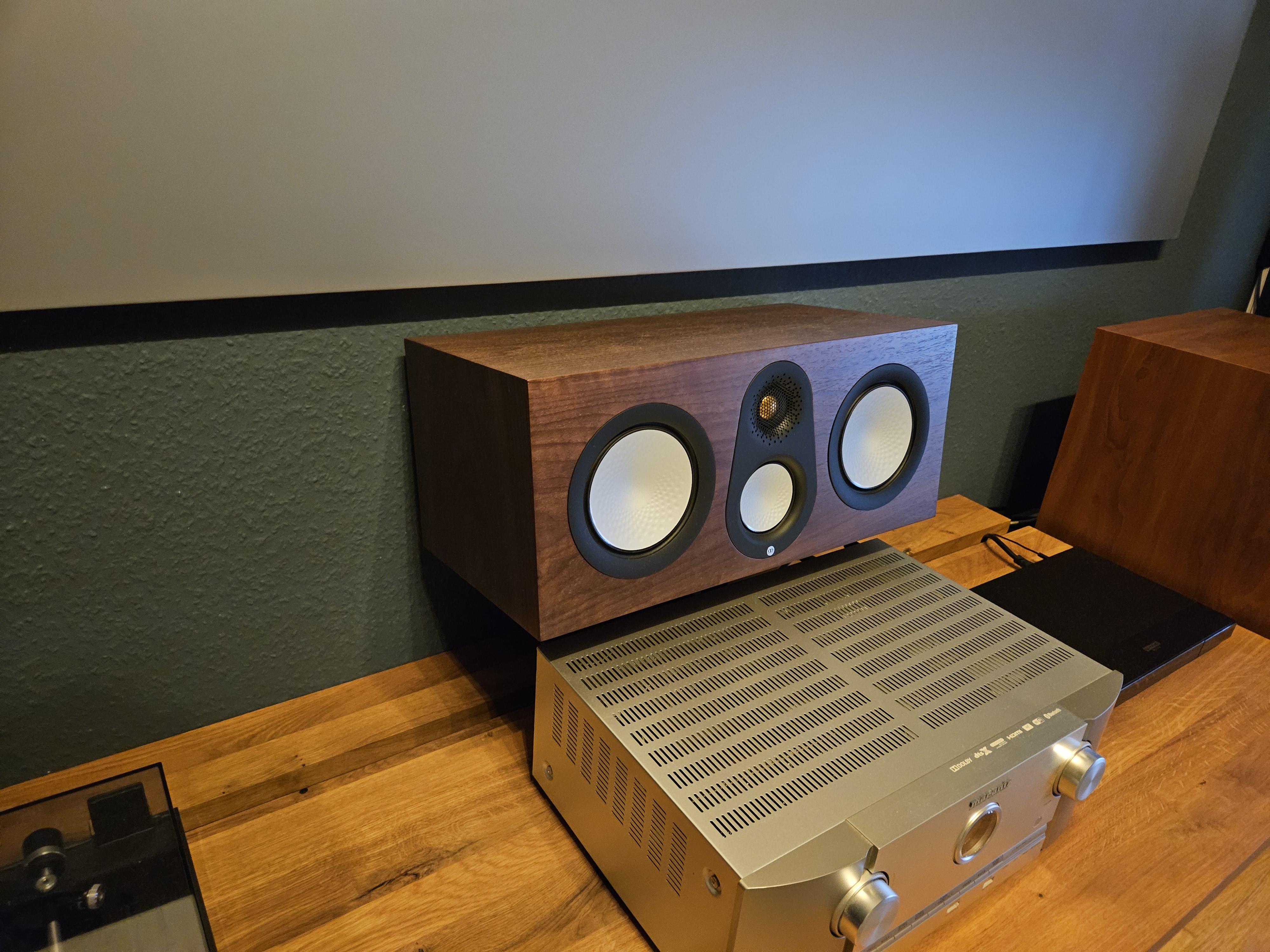 Angeled wall mount brackets for center speaker