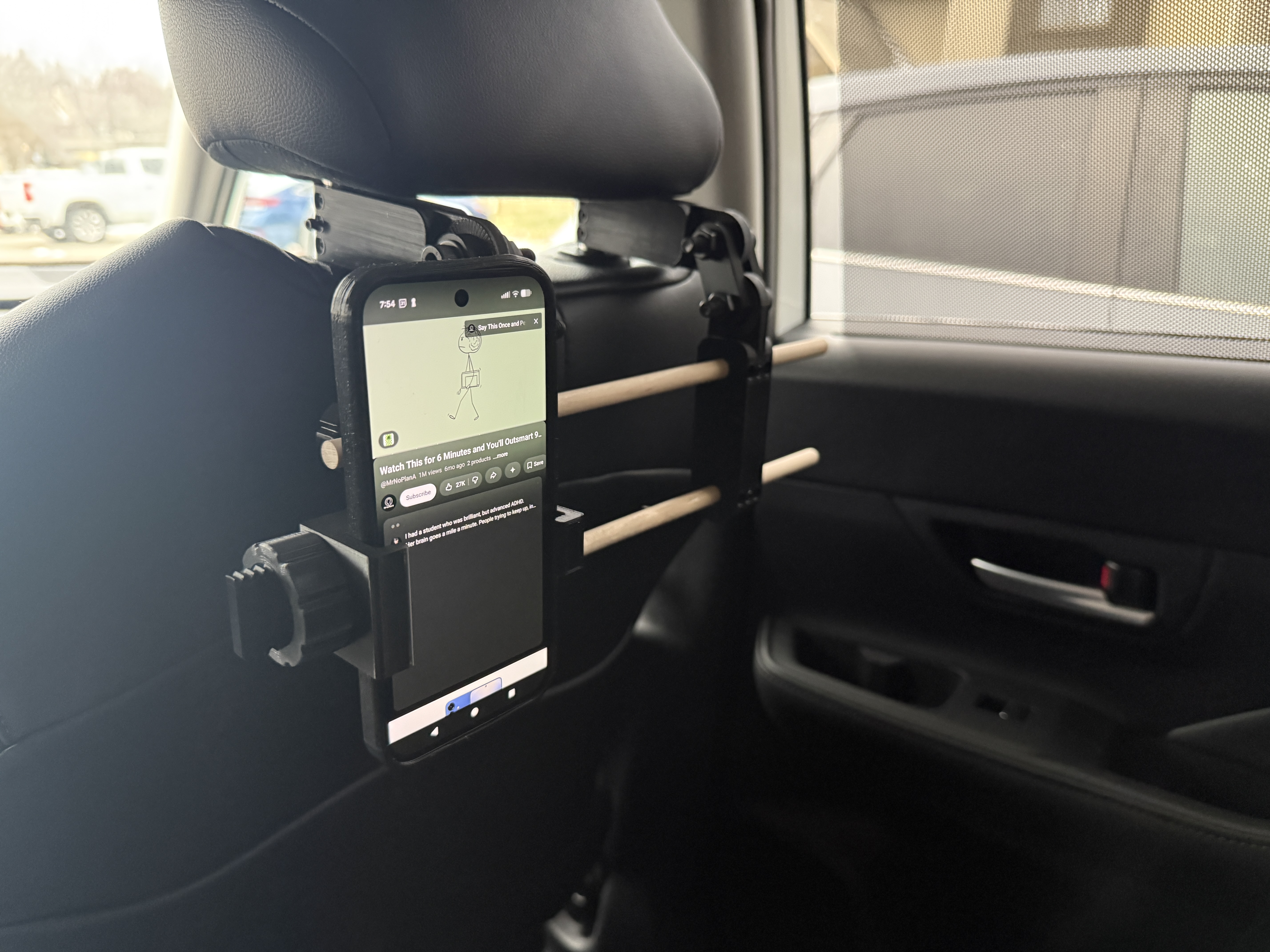 Backseat CEO: The Headrest Phone Mount That Means Business