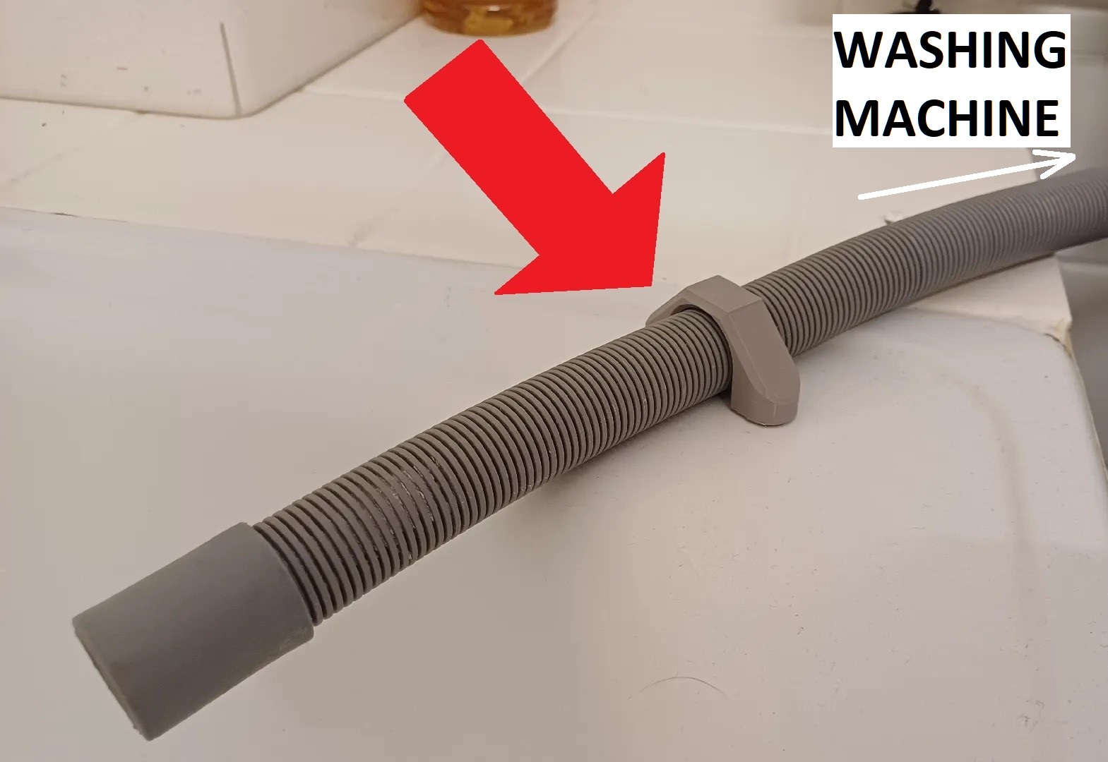 Washing machine drain hose holder