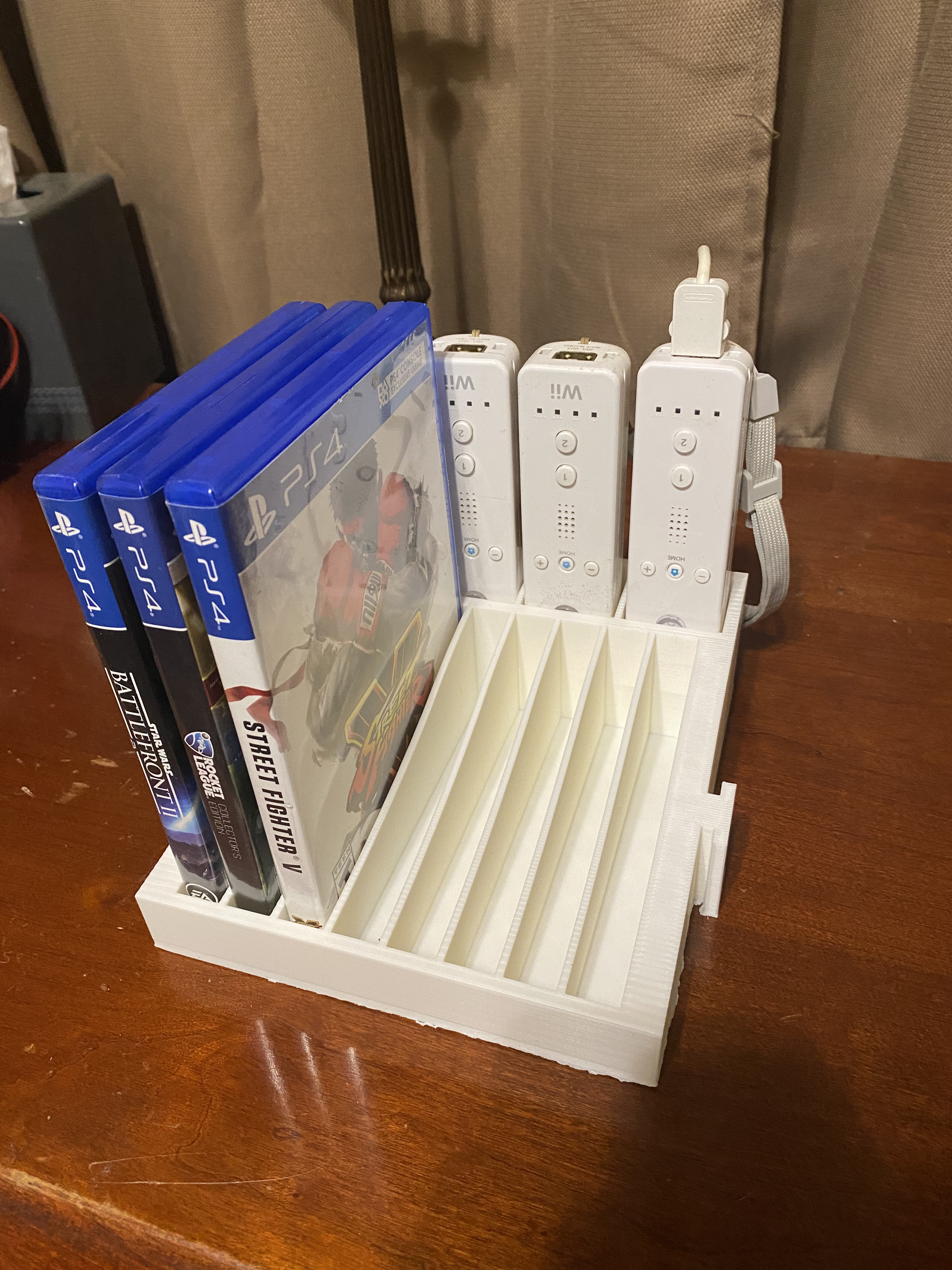 Modular Wii remote and disk holder