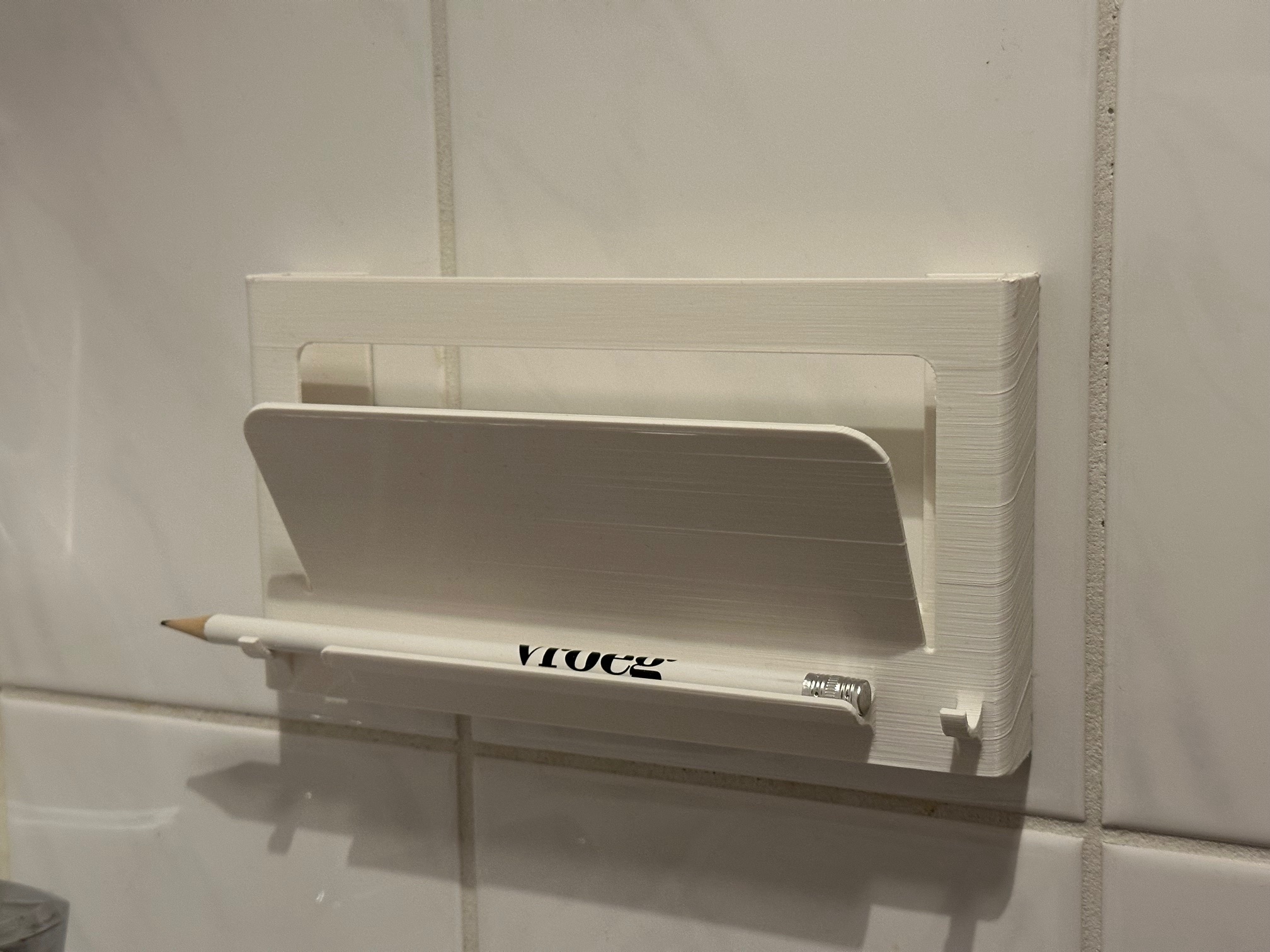 Puzzle bookshelf with place for pencil and towel.