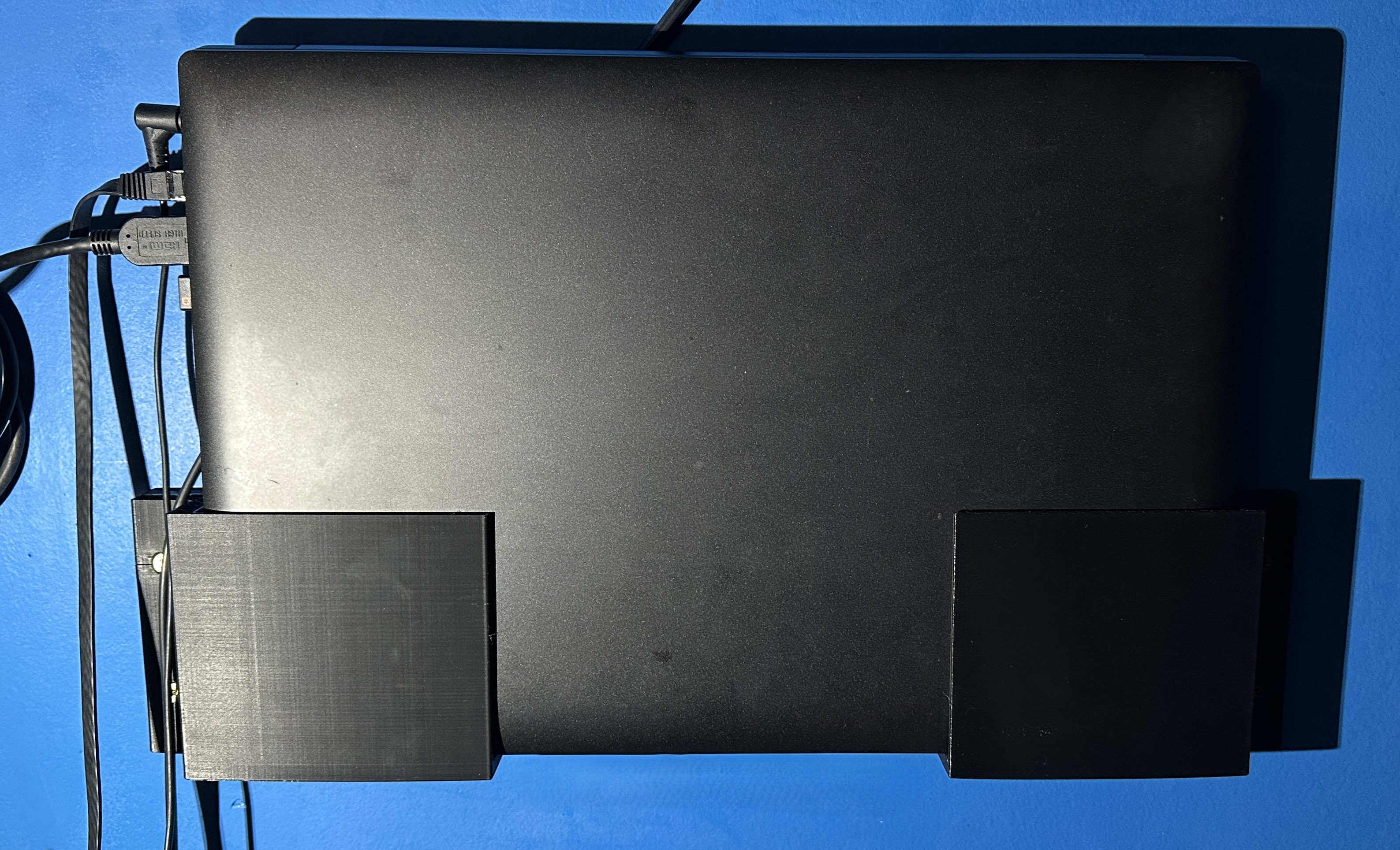 Laptop wall holder