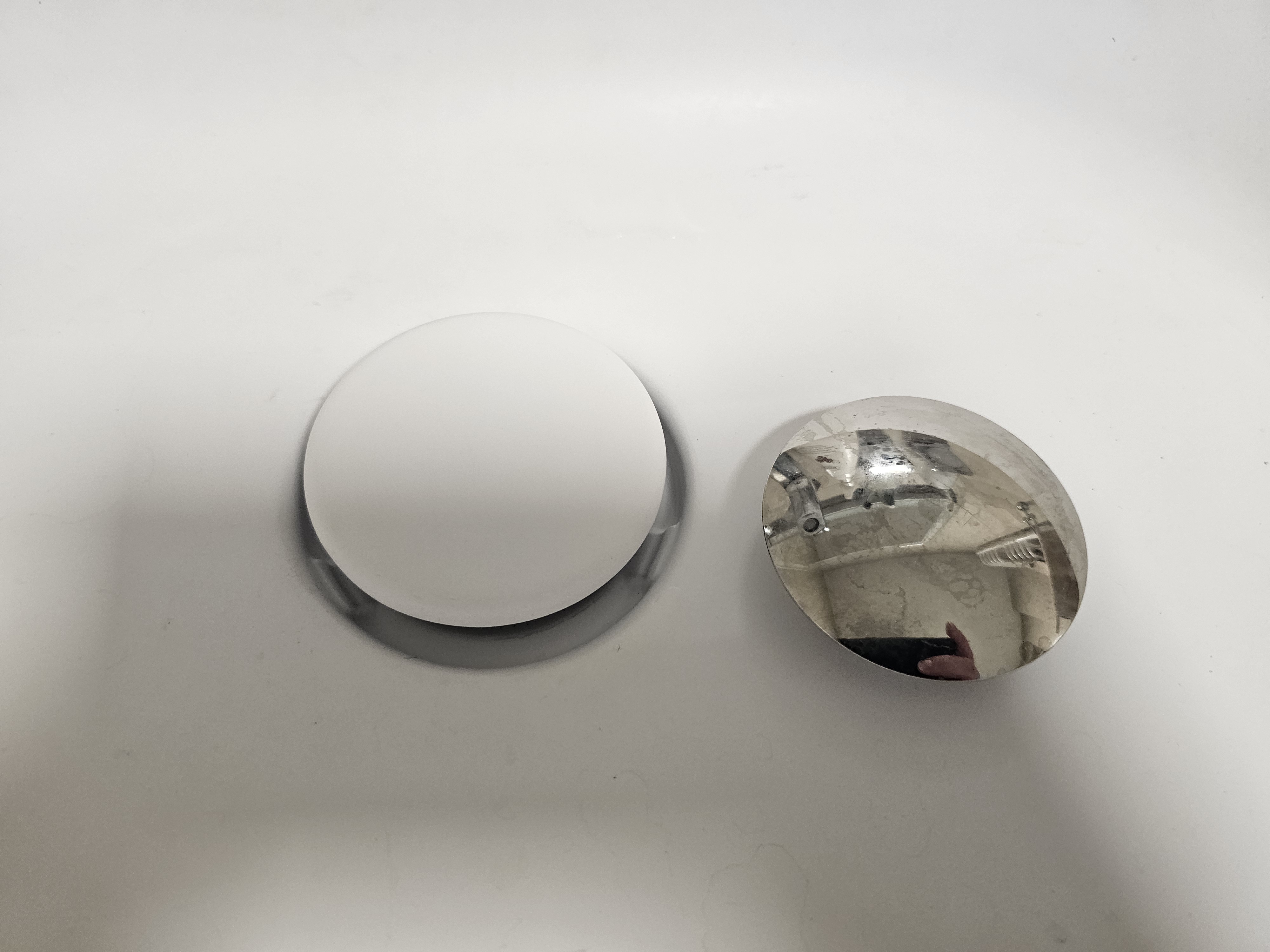 Cap holder for the click-clack drain for Fjoord Ramsa washbasin