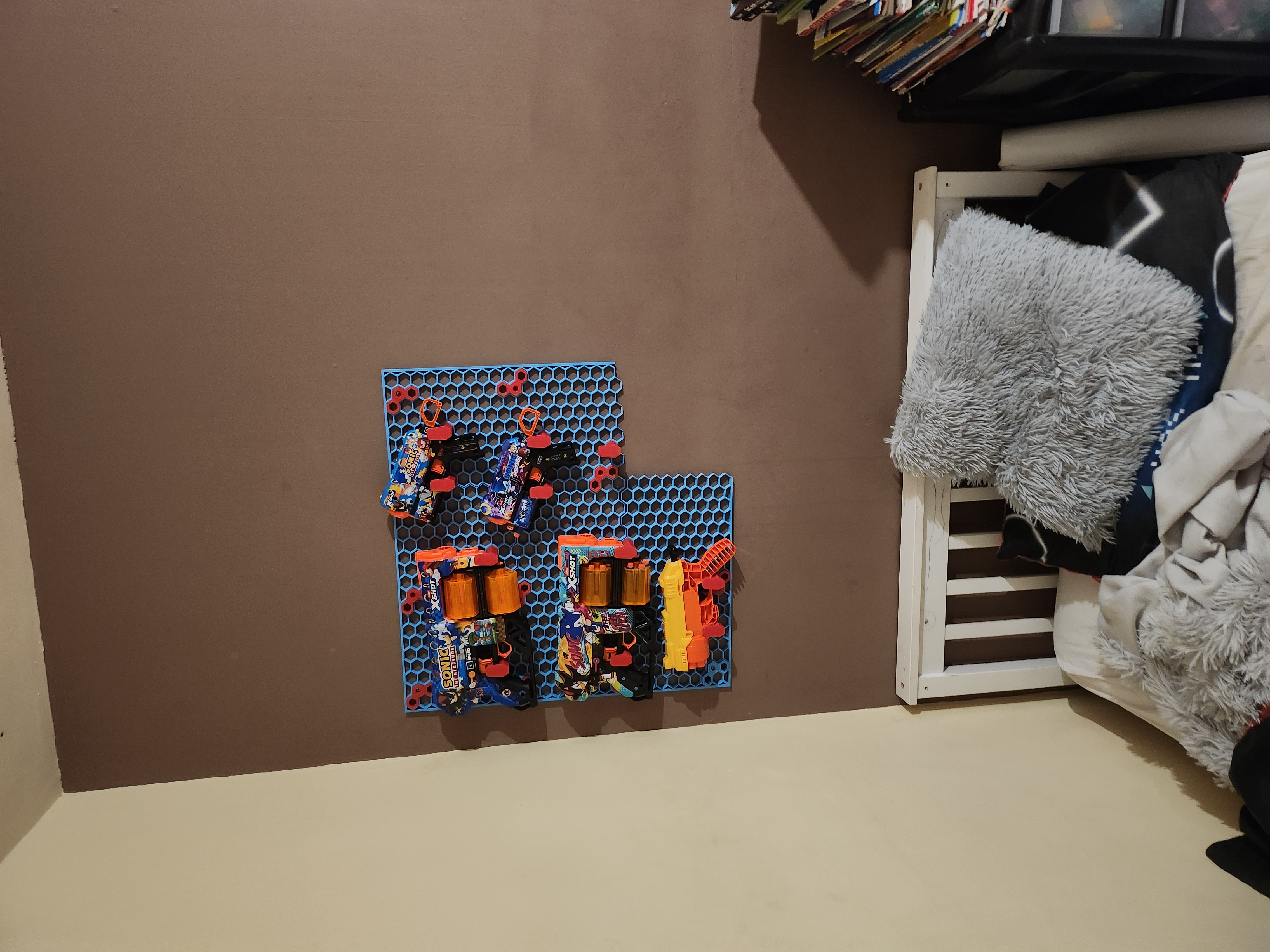 nerf gun hook honeycomb wall