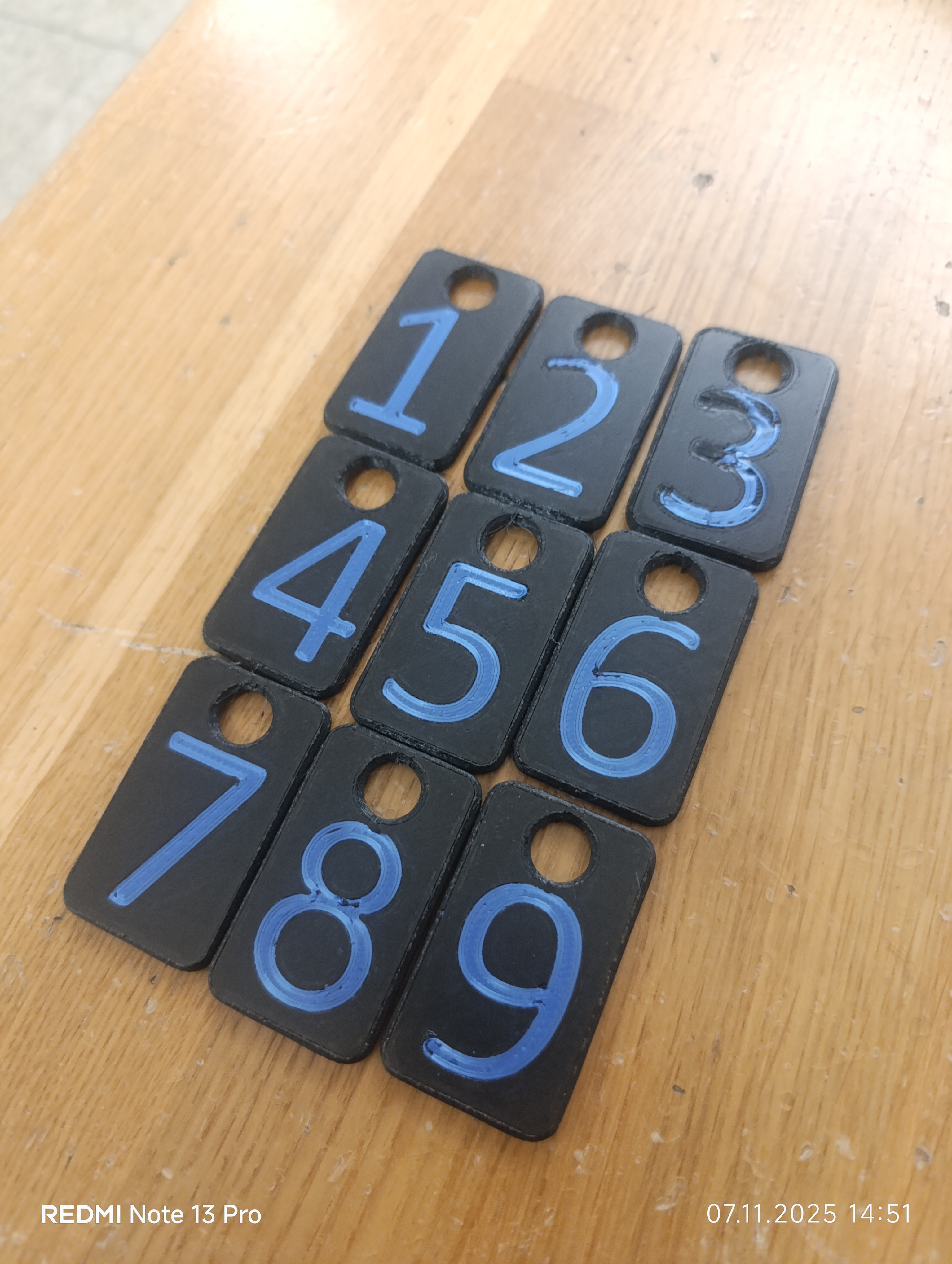 Keychains labeled 1-9