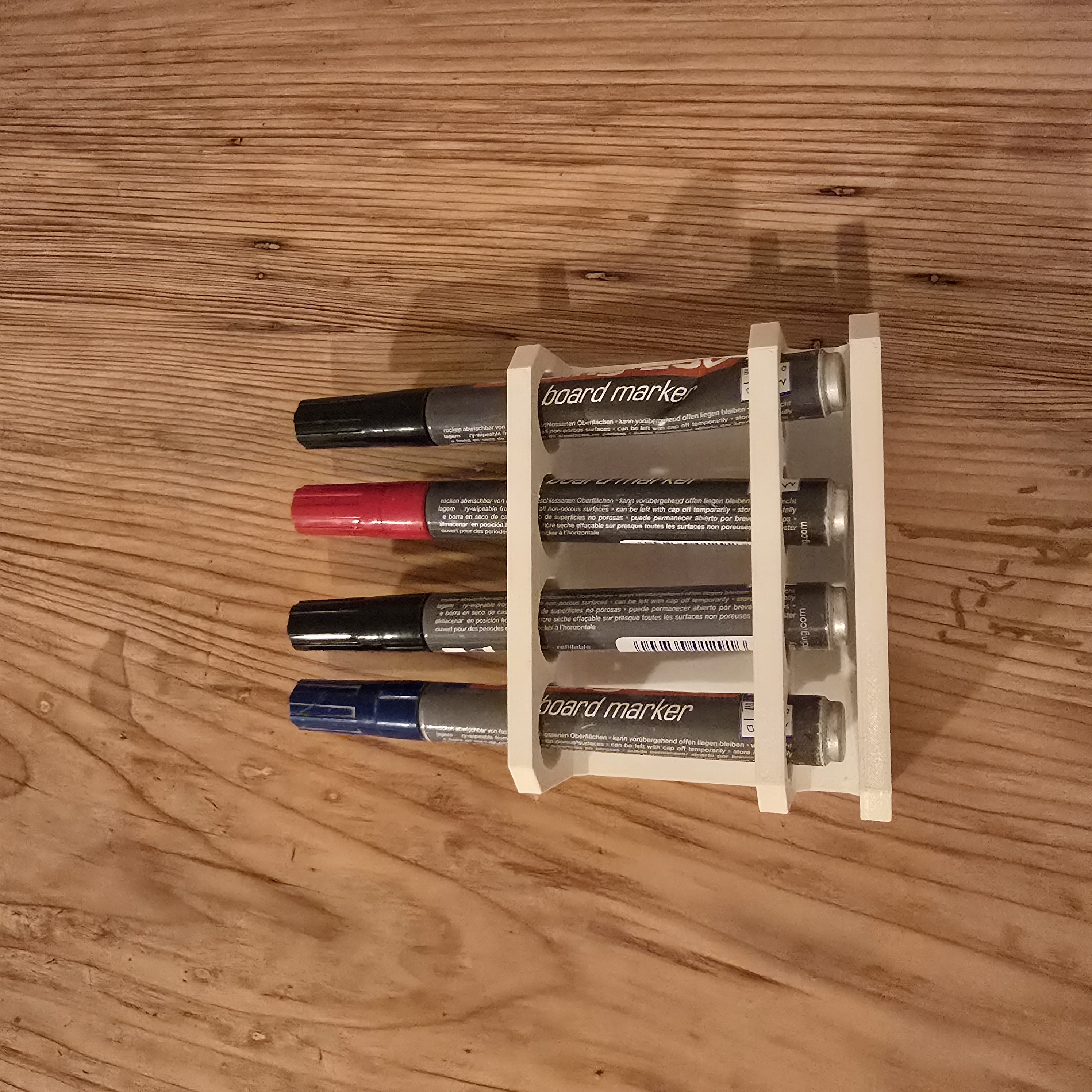 Magnetic holder for whiteboard markers