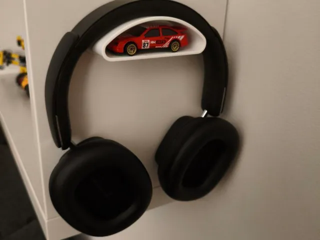 Headphone holder with extra storage compartment