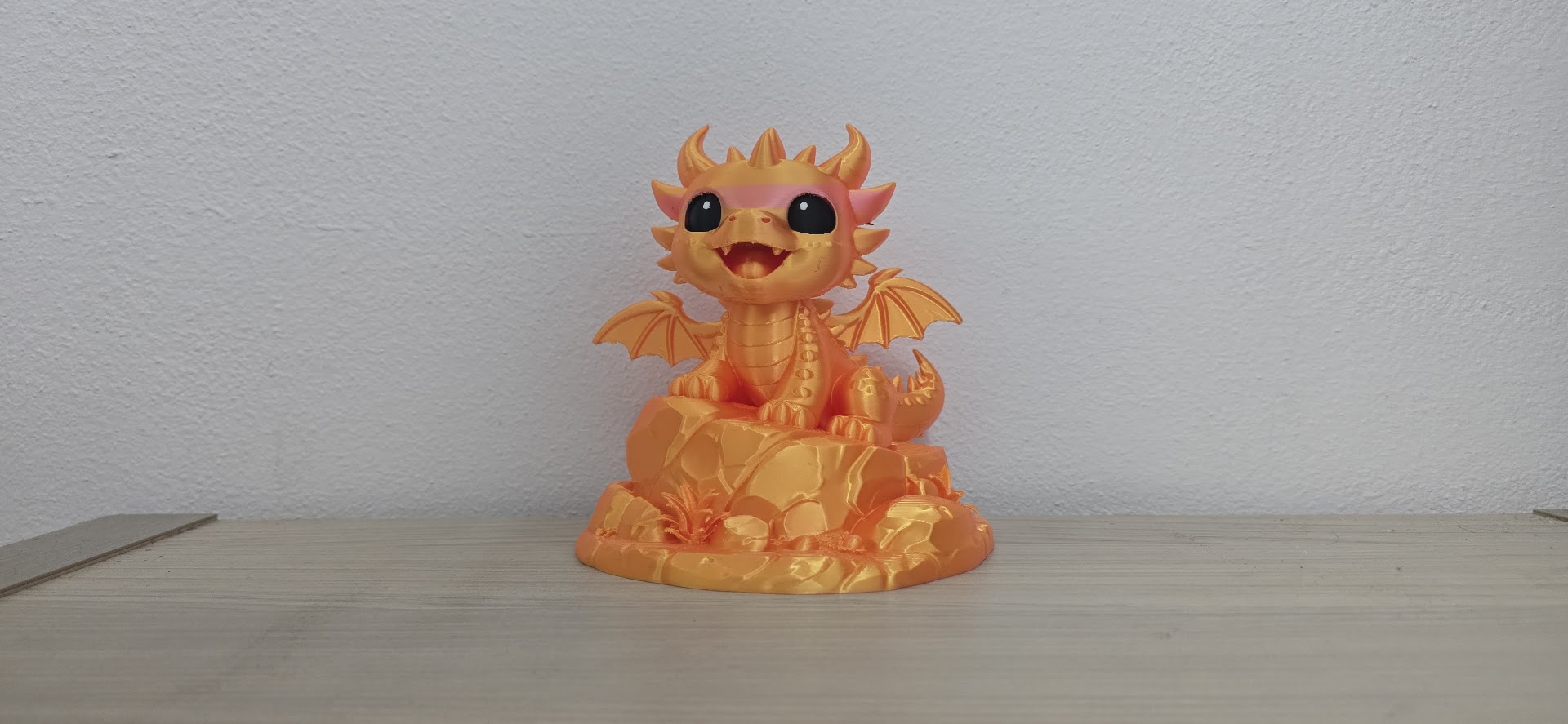 Cute Golden Dragon on Rock Statue