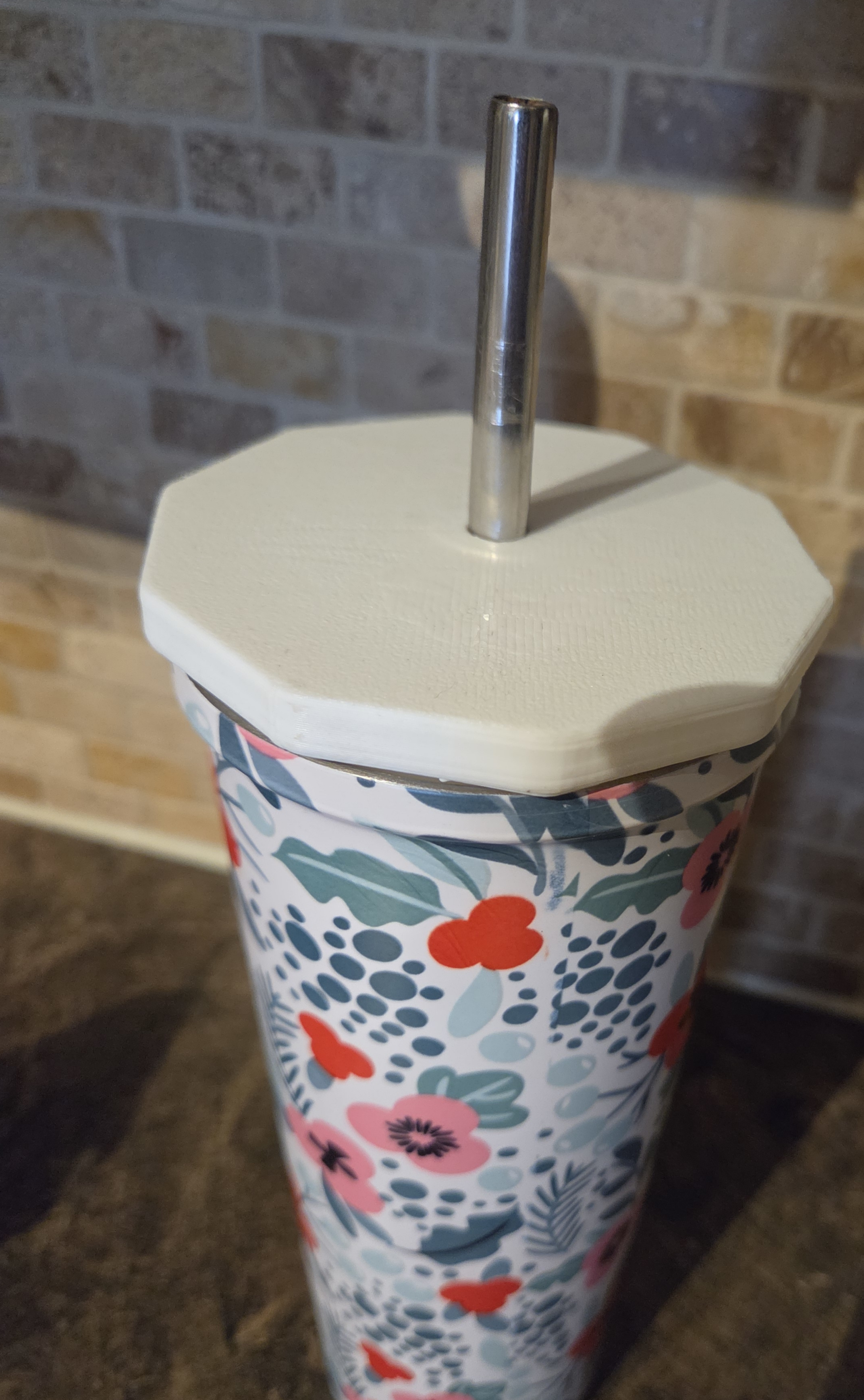 Cup cover with a straw