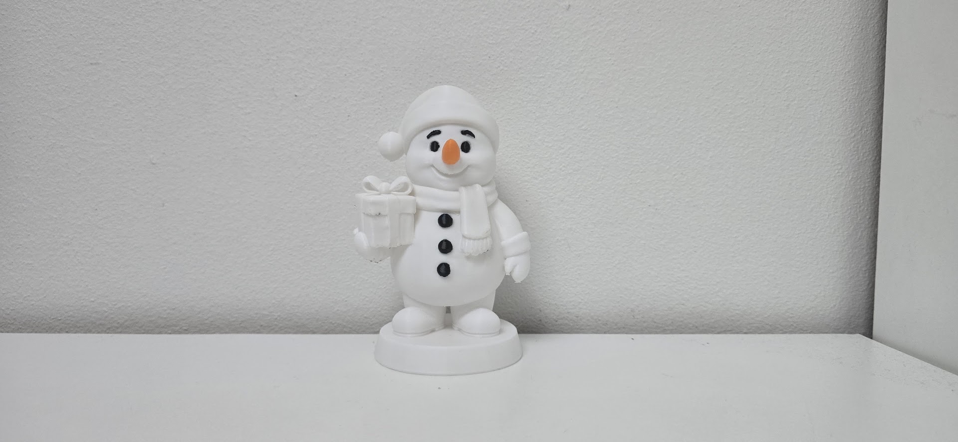 Cute Smiling Snowman with Gift Christmas Figurine