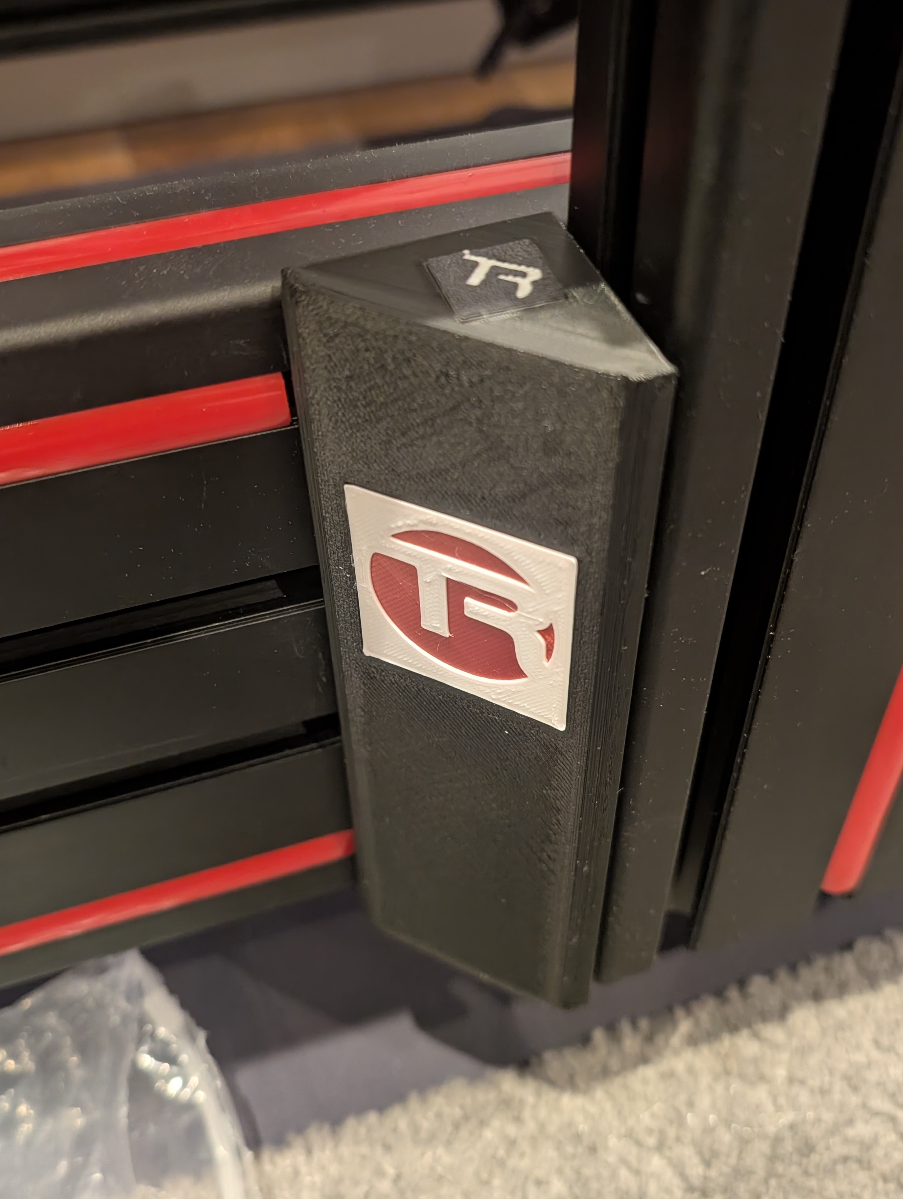 Trak Racer sim rig hiding connector with logo