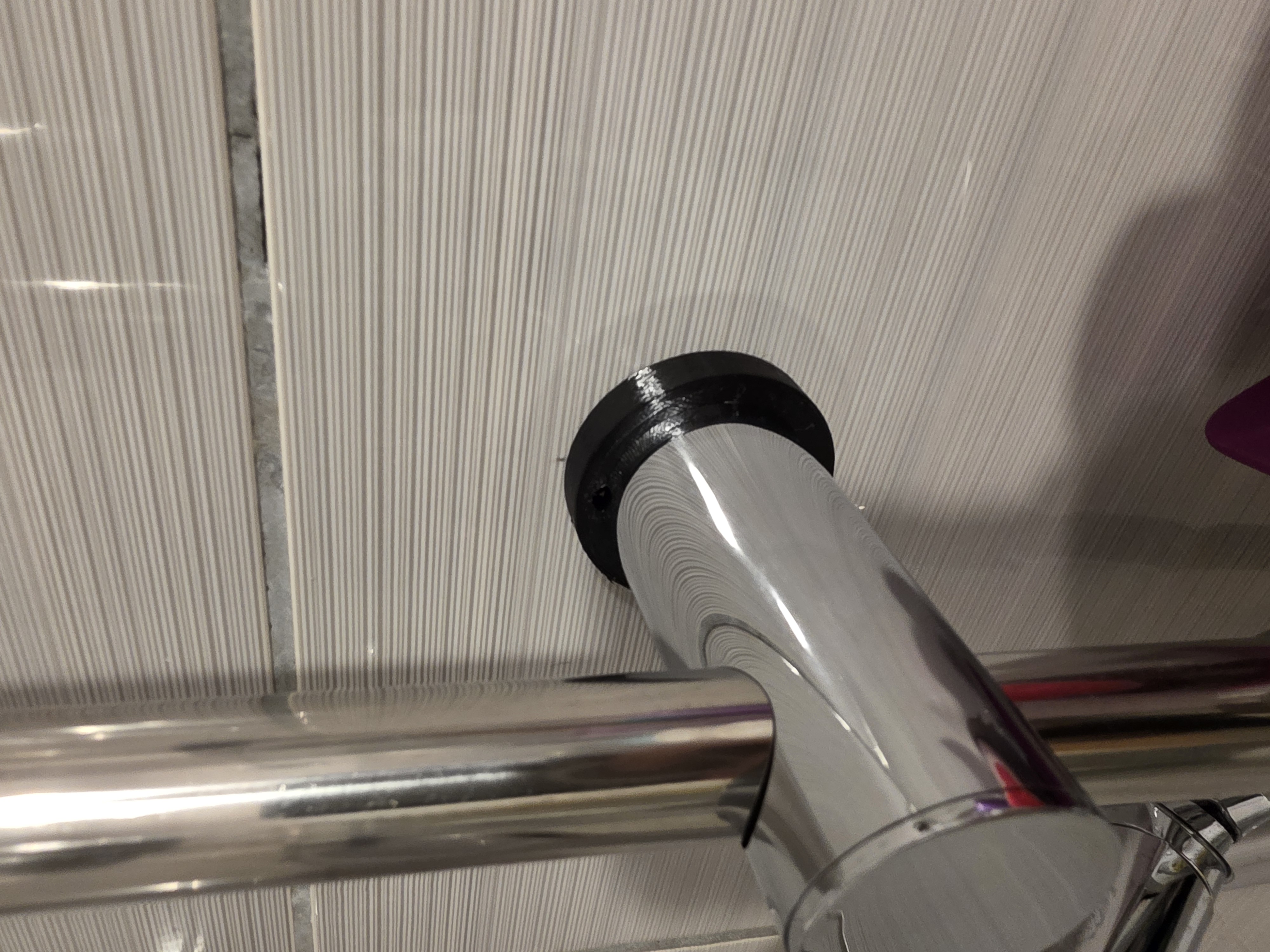Spacer with rotated holes for shower column