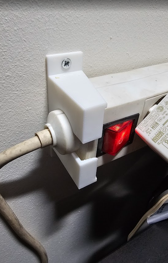 Power strip holder for power strip with ferrite bead